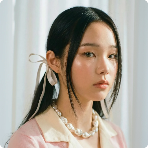 Place the necklace on the woman in this photo, natural lighting.