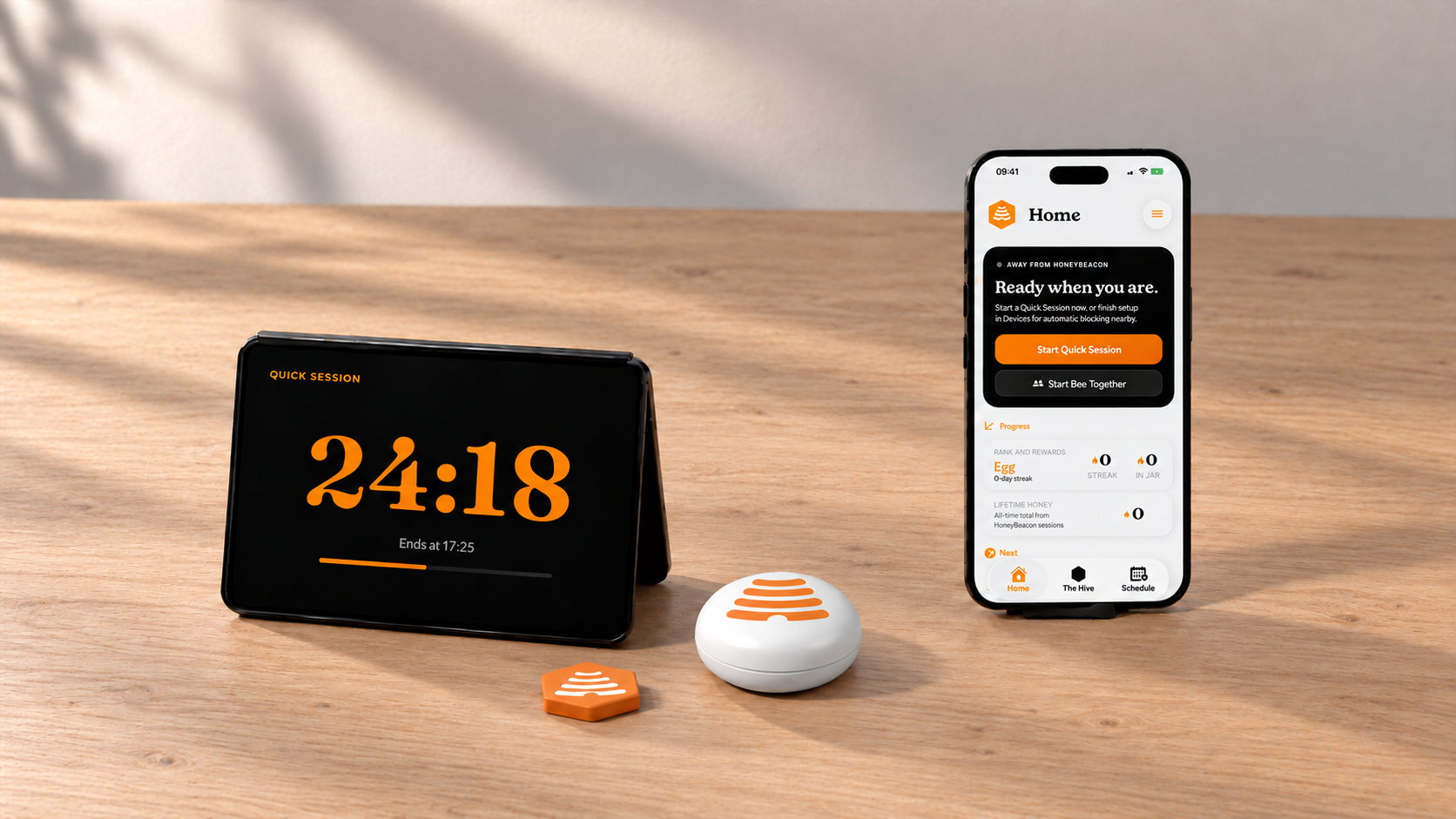 HoneyBeacon and HoneyTag beside two black phones showing a focus timer and the HoneyBeacon app