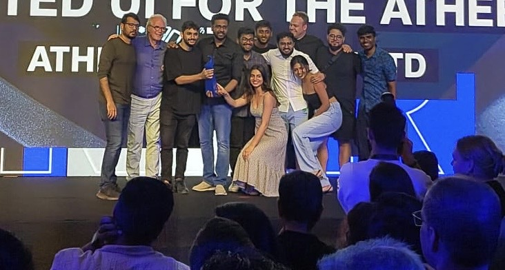 The Ather team on stage holding an award at the Kyoorius Creative Awards