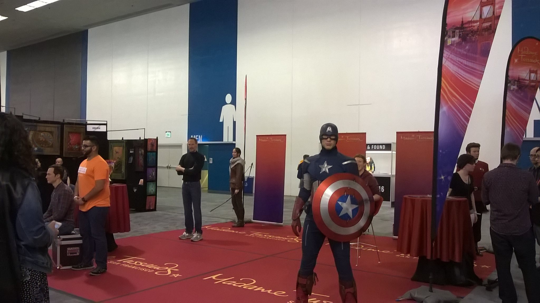 wax figures of marvel characters on a convention floor