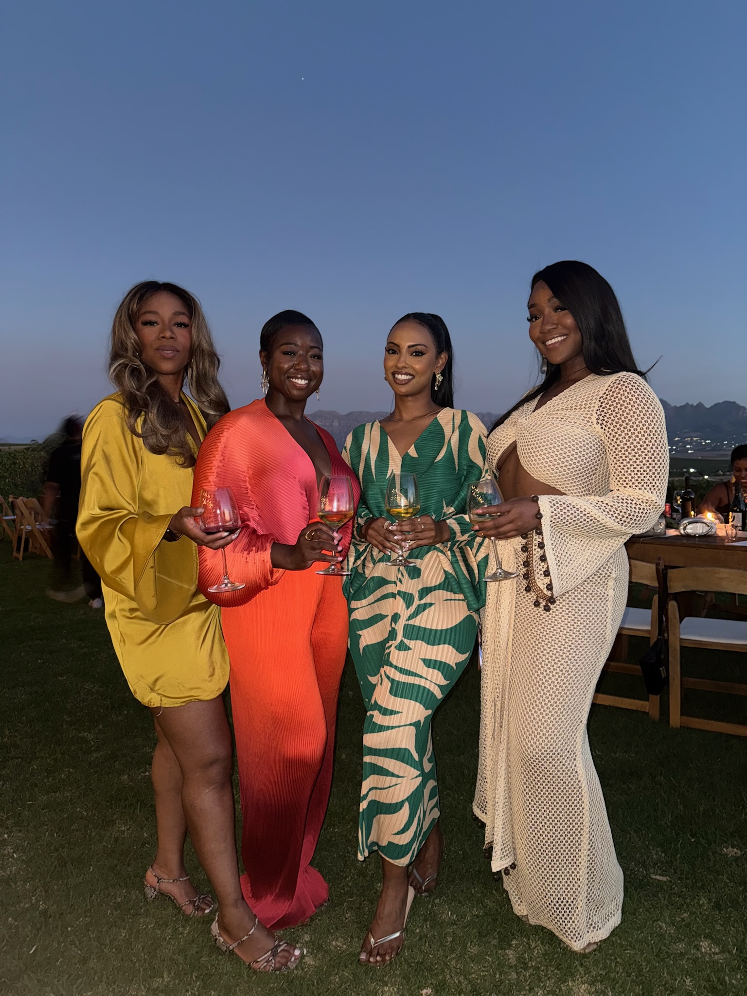 Four friends sharing an evening outdoors