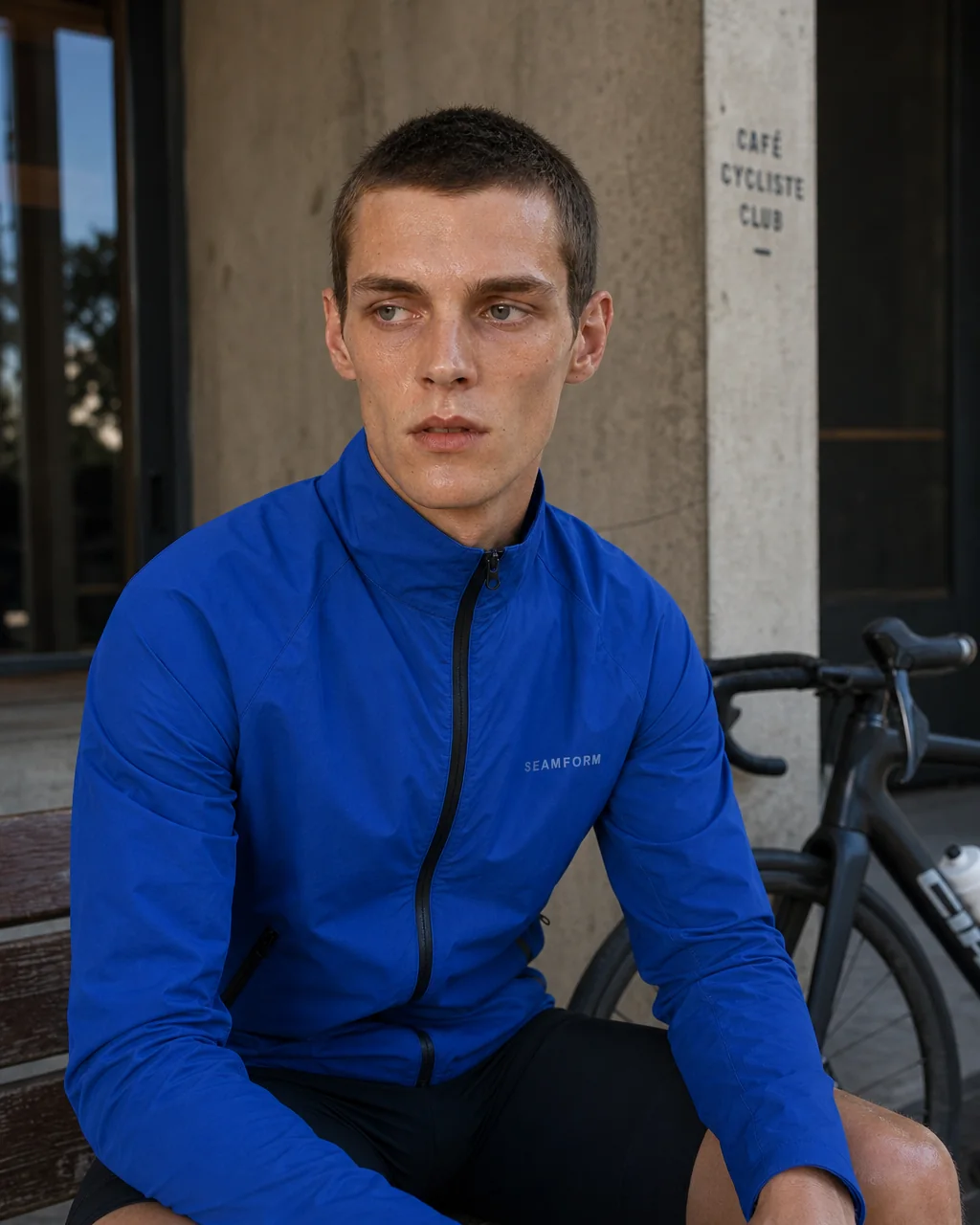A cyclist resting after a ride in the SEAMFORM SF-01.