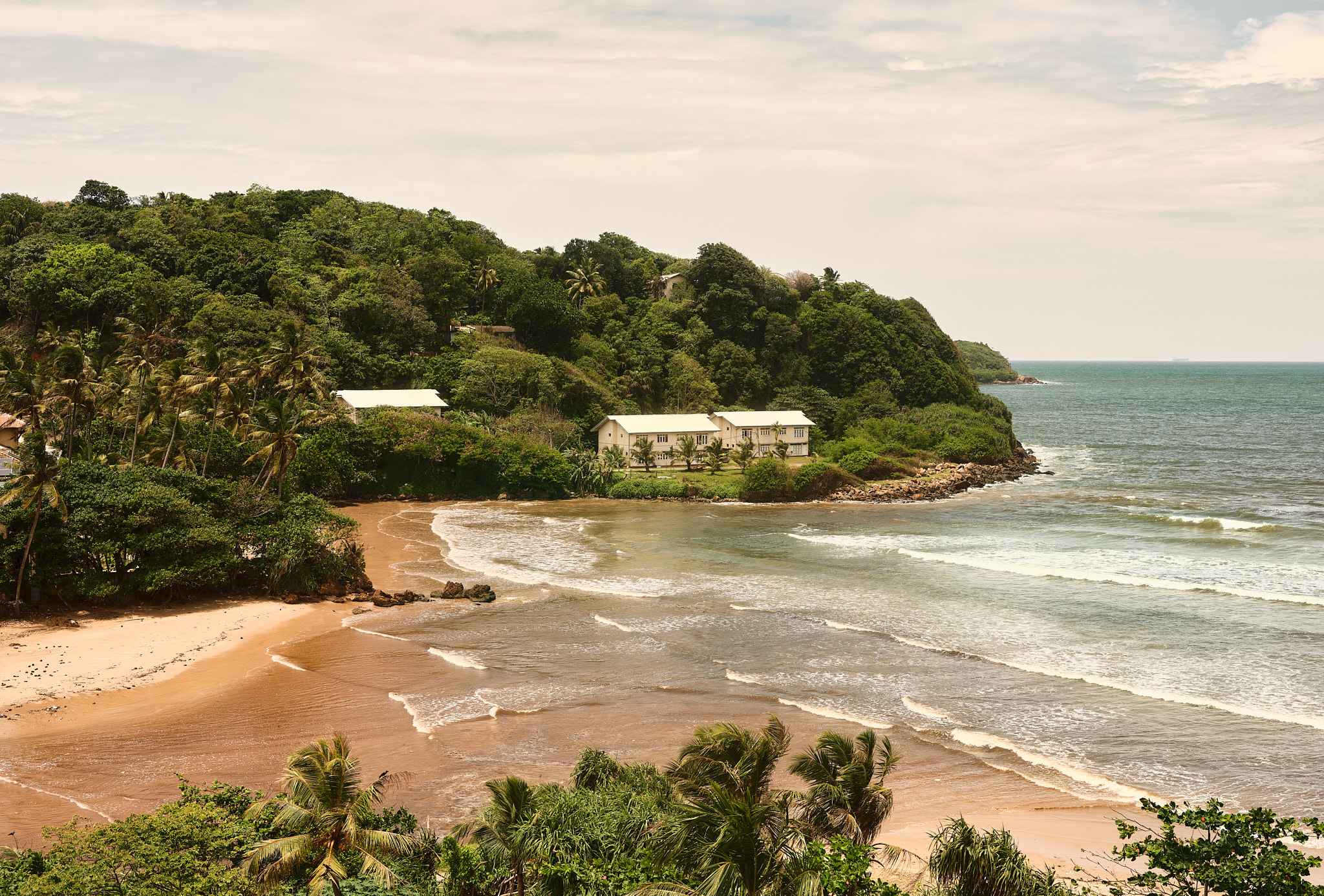 Bay and jungle-covered headland near Otherland Galle