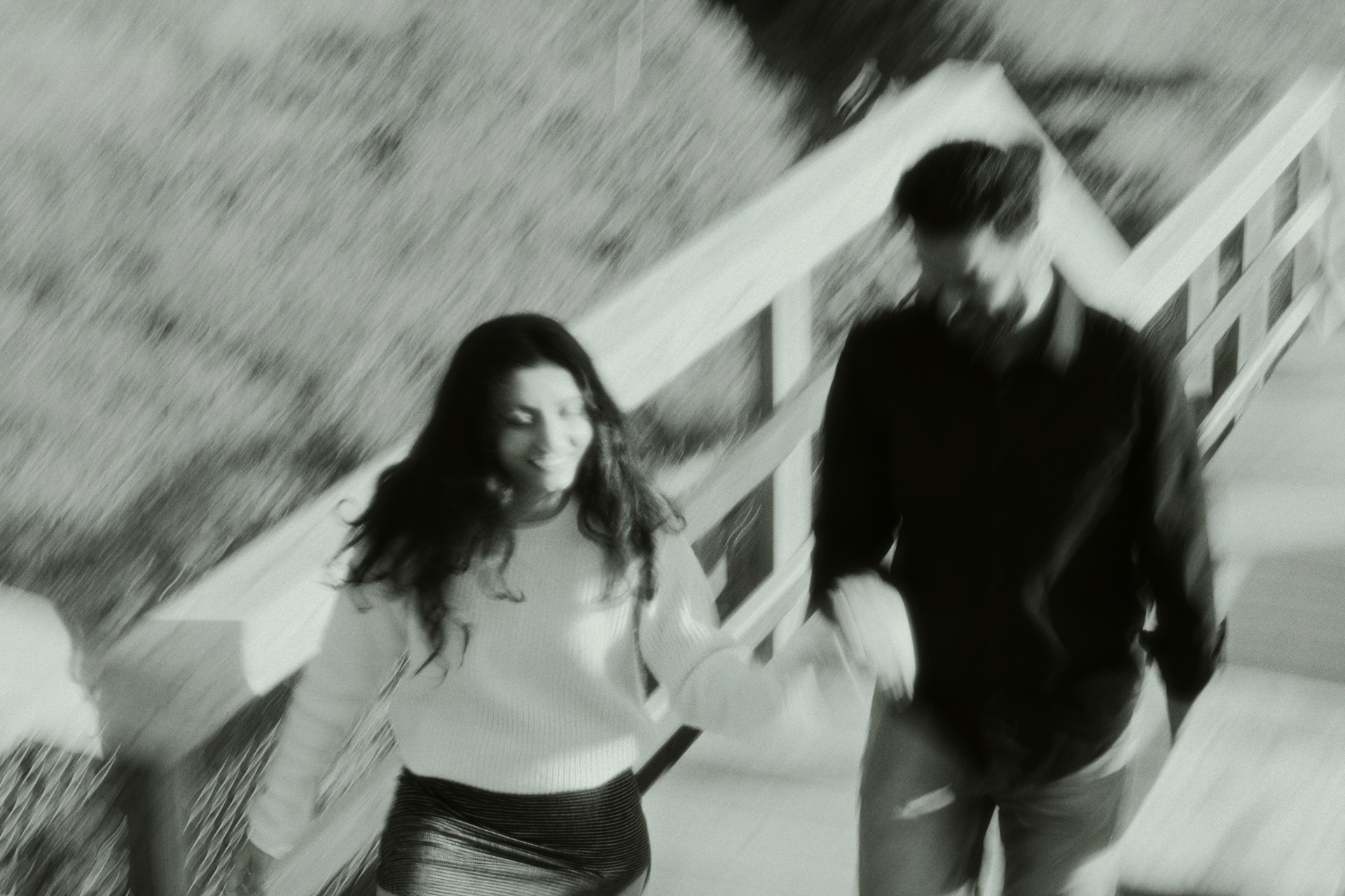 person sitting on grass and using phone