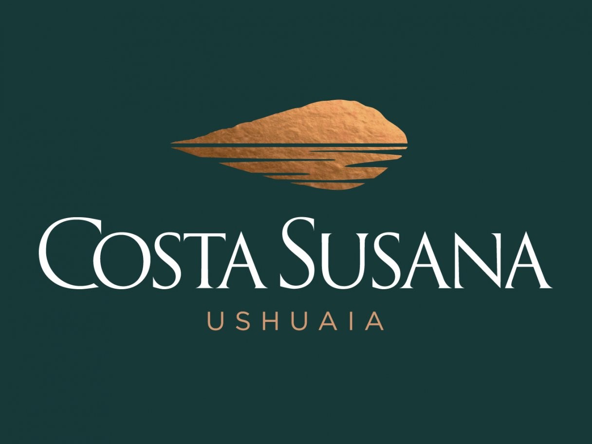 Rustic cabin in a golden field at sunset