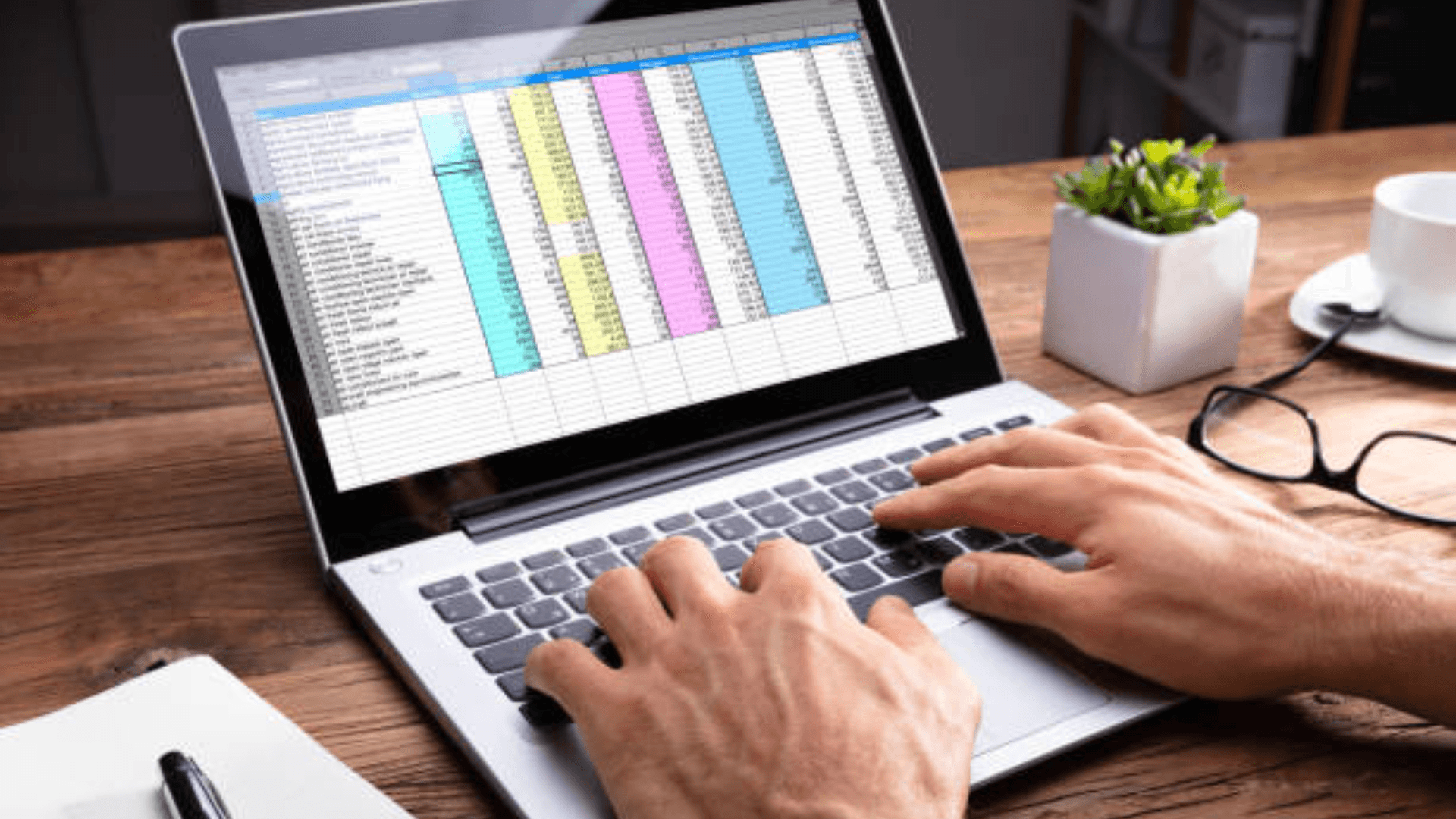 Man using spreadsheet -  How to Find Duplicates in Google Sheets