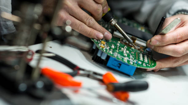 a yellow robot sitting on top of a table