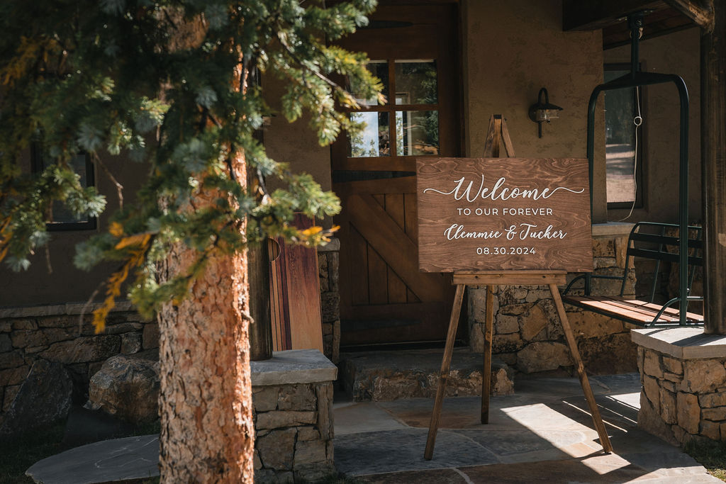 Wooden wedding sign reading “Welcome to our forever, 08.10.24”
