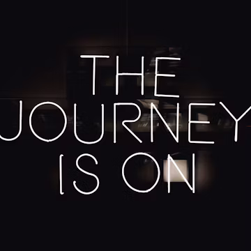 a black and white photo with the words the journey is on