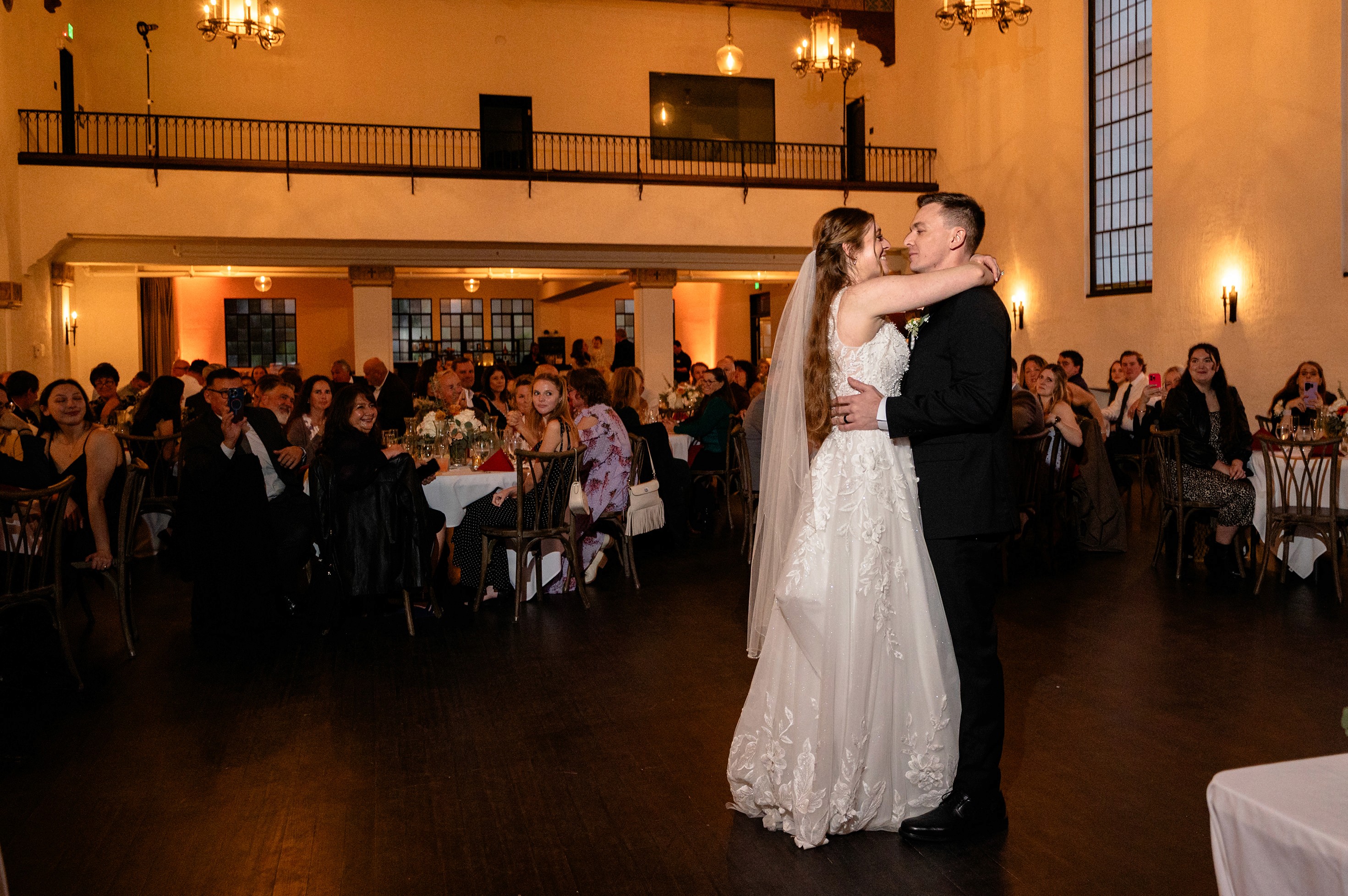 Flat lay wedding details with bouquet, rings, and sparkling bridal heels