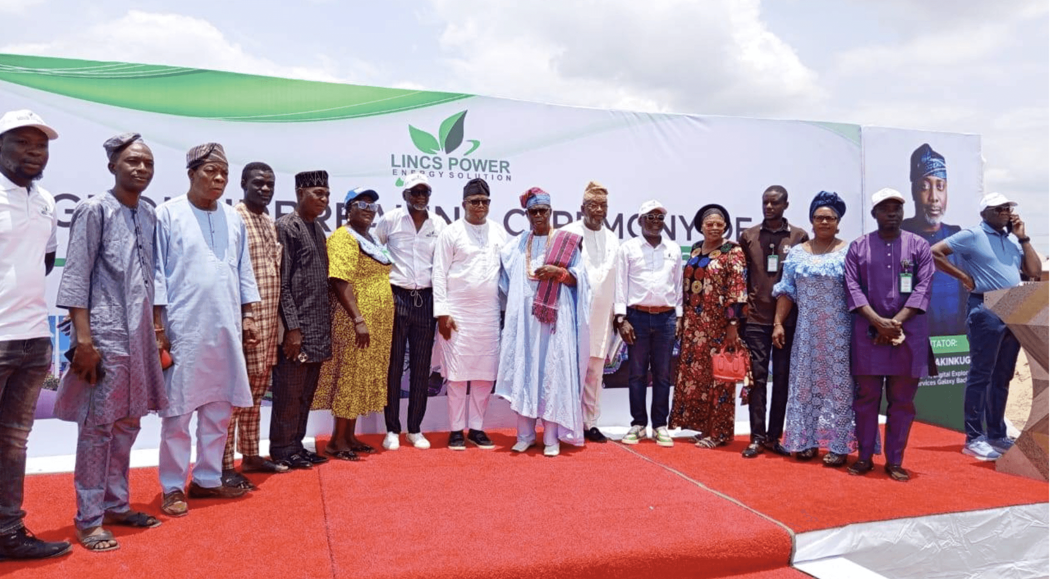 Smiling man presenting ideas to a group in a website development workshop.