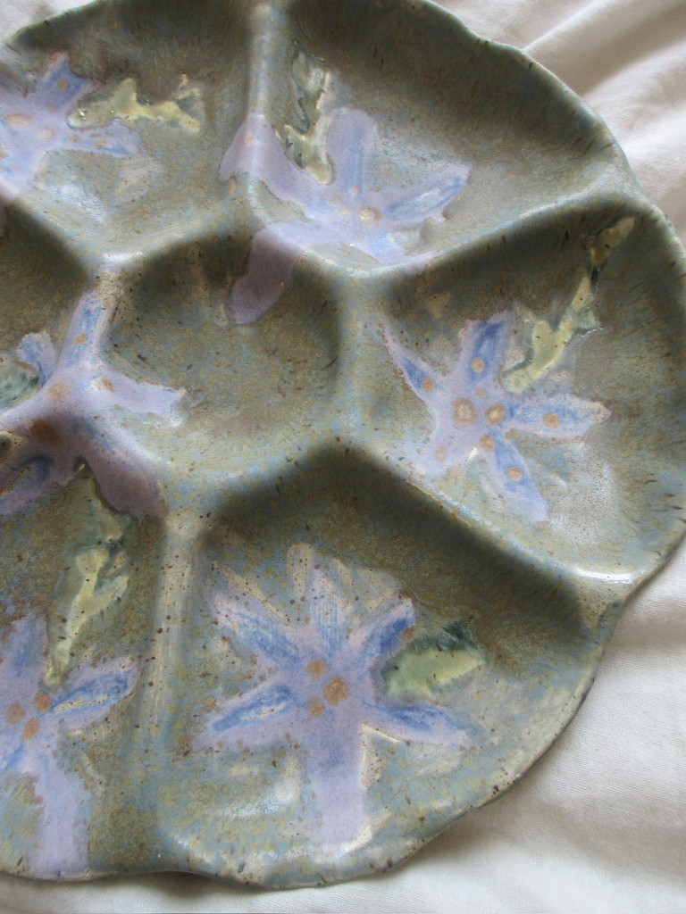 Green ceramic sectioned plate with hand-painted purple and pink floral design