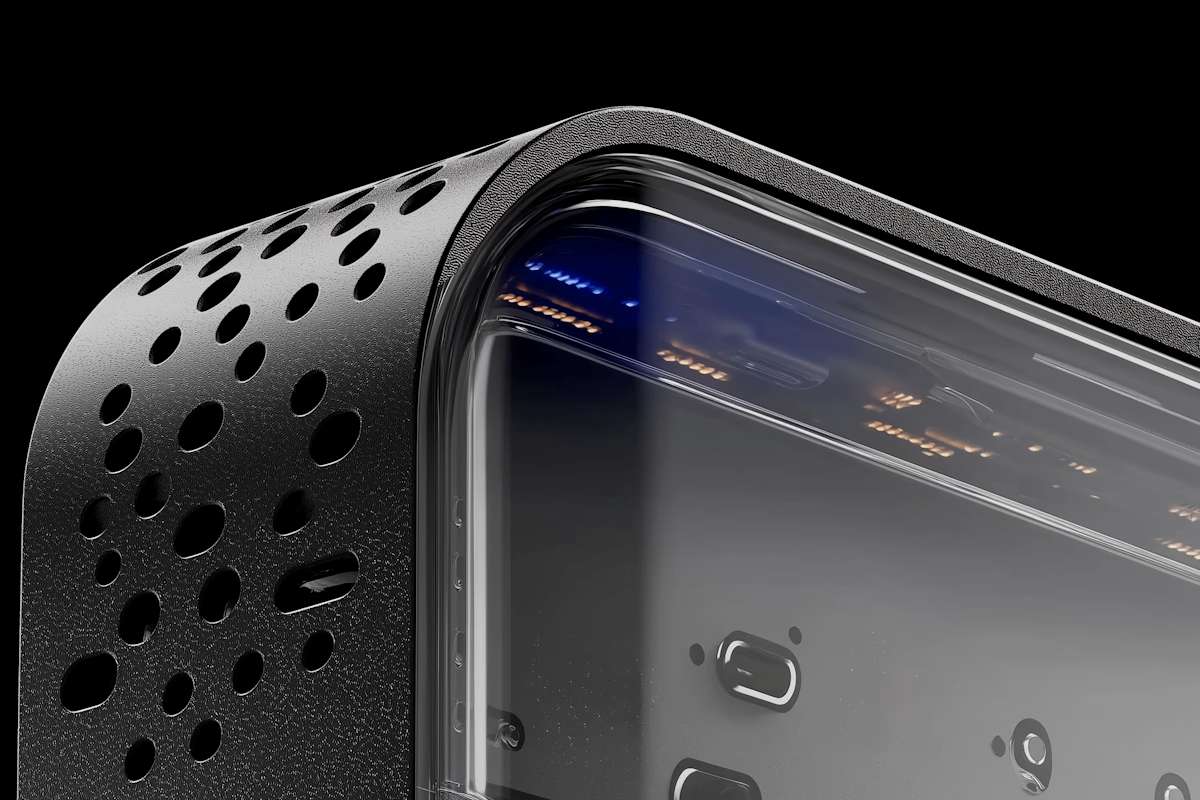 Close-up of a modern electronic device with a transparent casing and gradient blue lighting, showcasing sleek design and internal components.