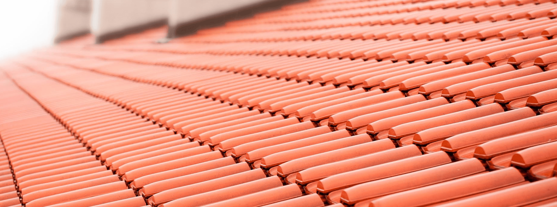a man in a yellow shirt is working on a roof