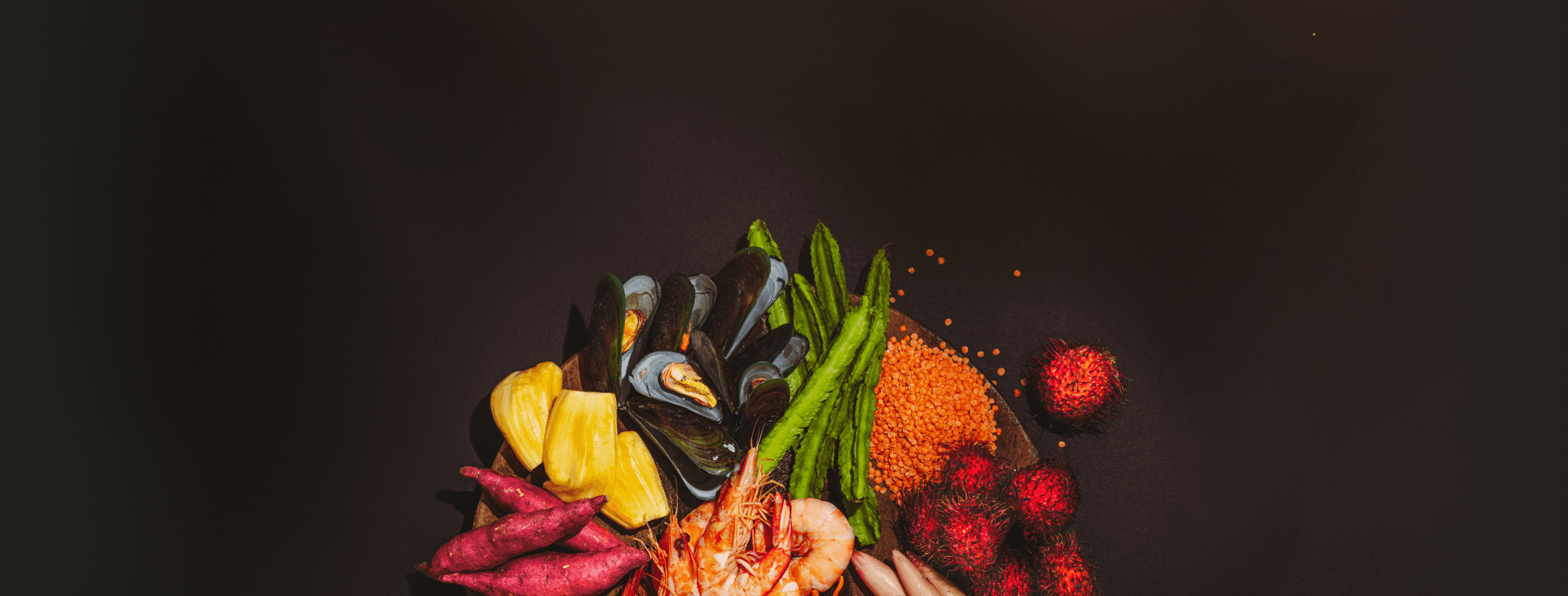 Plate of fresh food with some ingredients spilling off it.