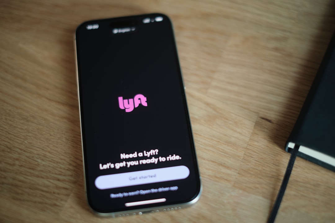 A cell phone sitting on top of a wooden table