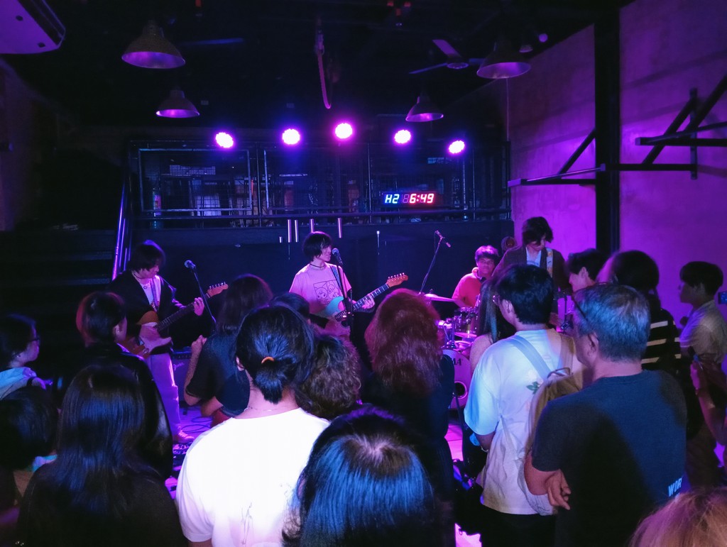 Photo of an Abot Tala member performing at their gig.