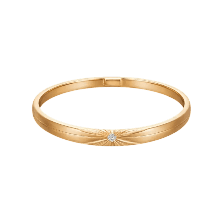Gold bracelet with a diamond on a white background