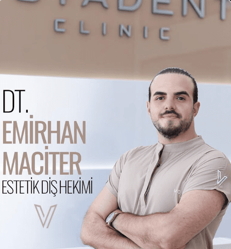 Portrait of the head dentist at Voyadent Clinic standing with folded arms.
