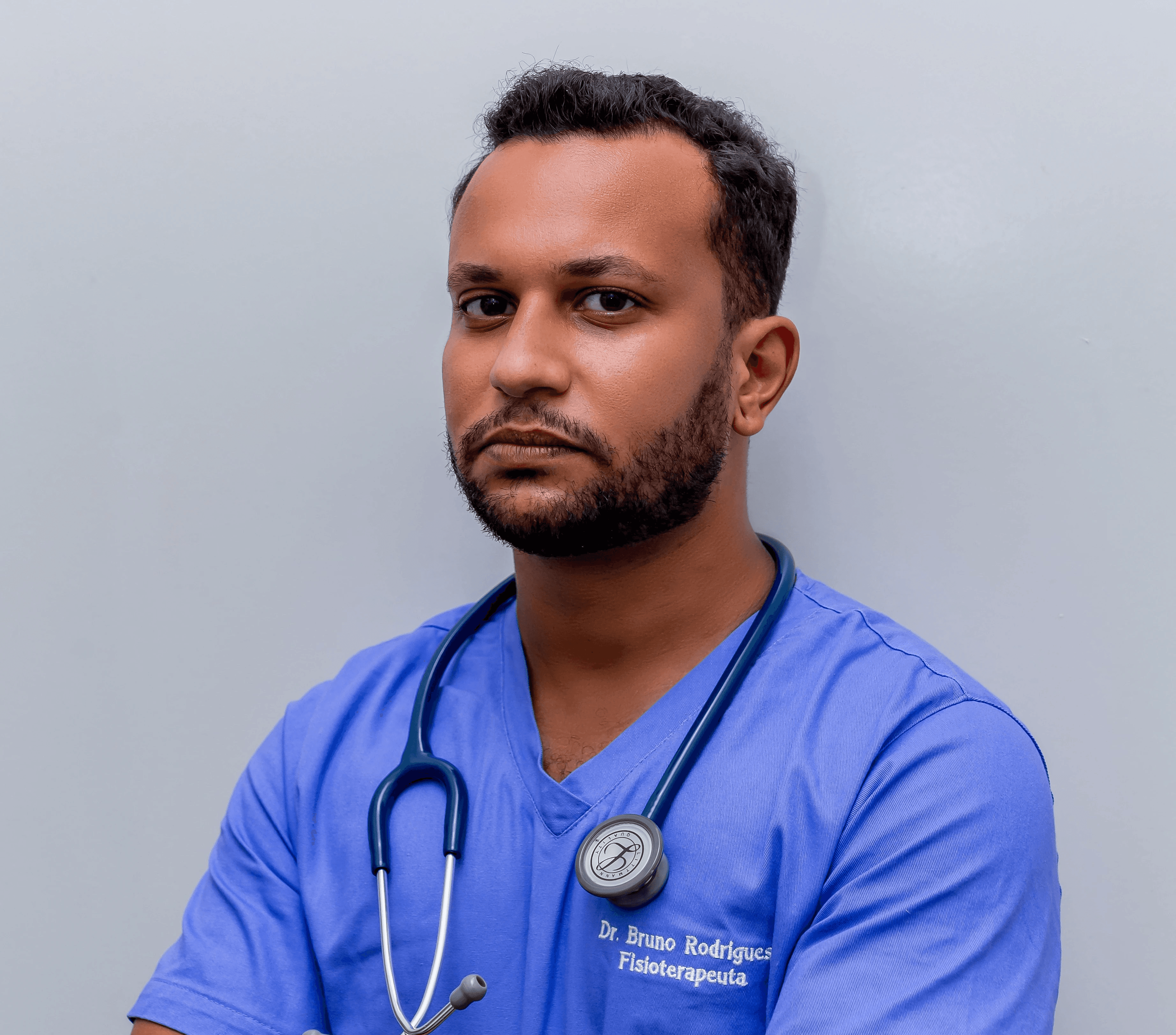 man in blue crew neck t-shirt wearing blue stethoscope
