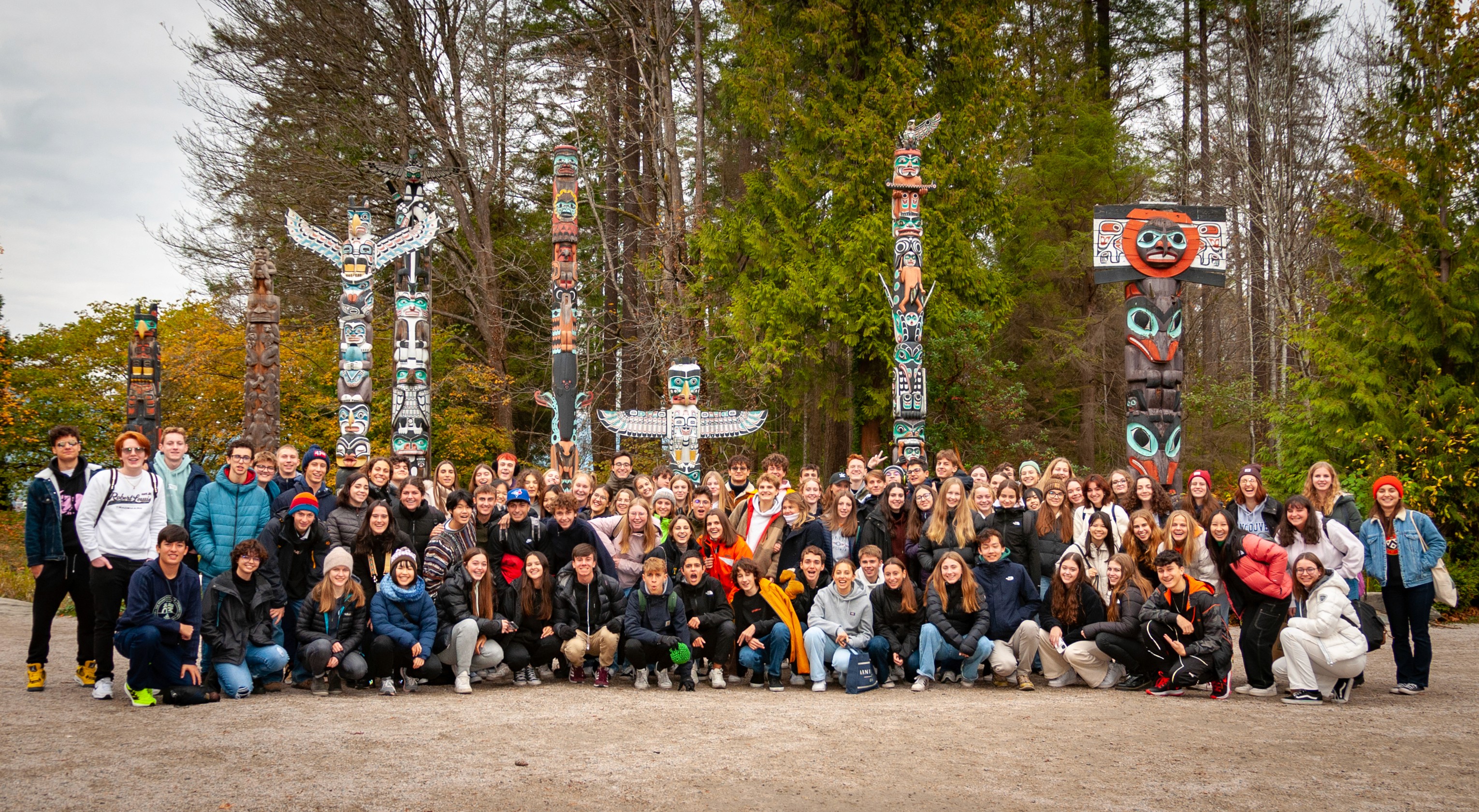 a large building with a dome on top of it surrounded by trees