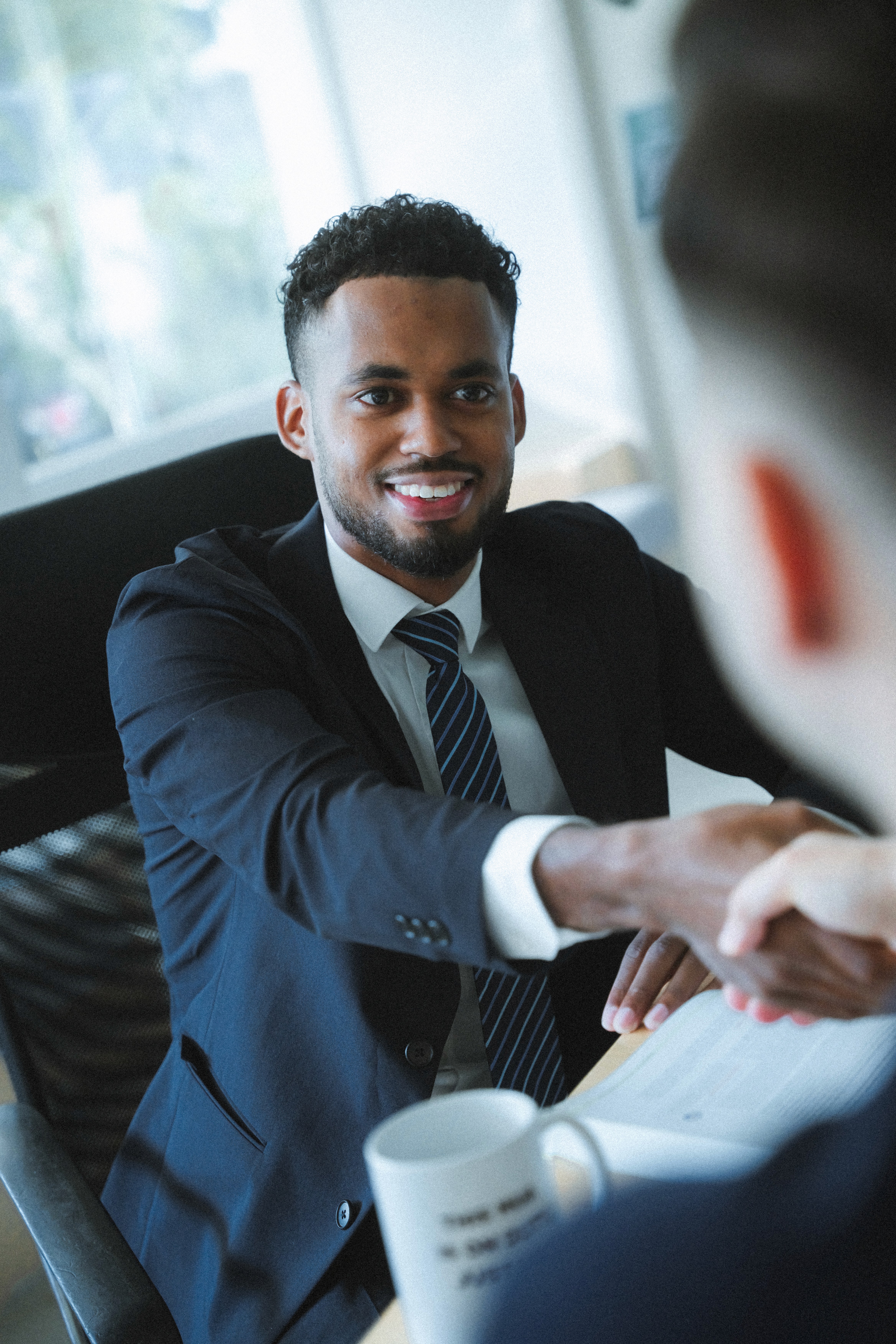 Warm-toned blurred office meeting scene