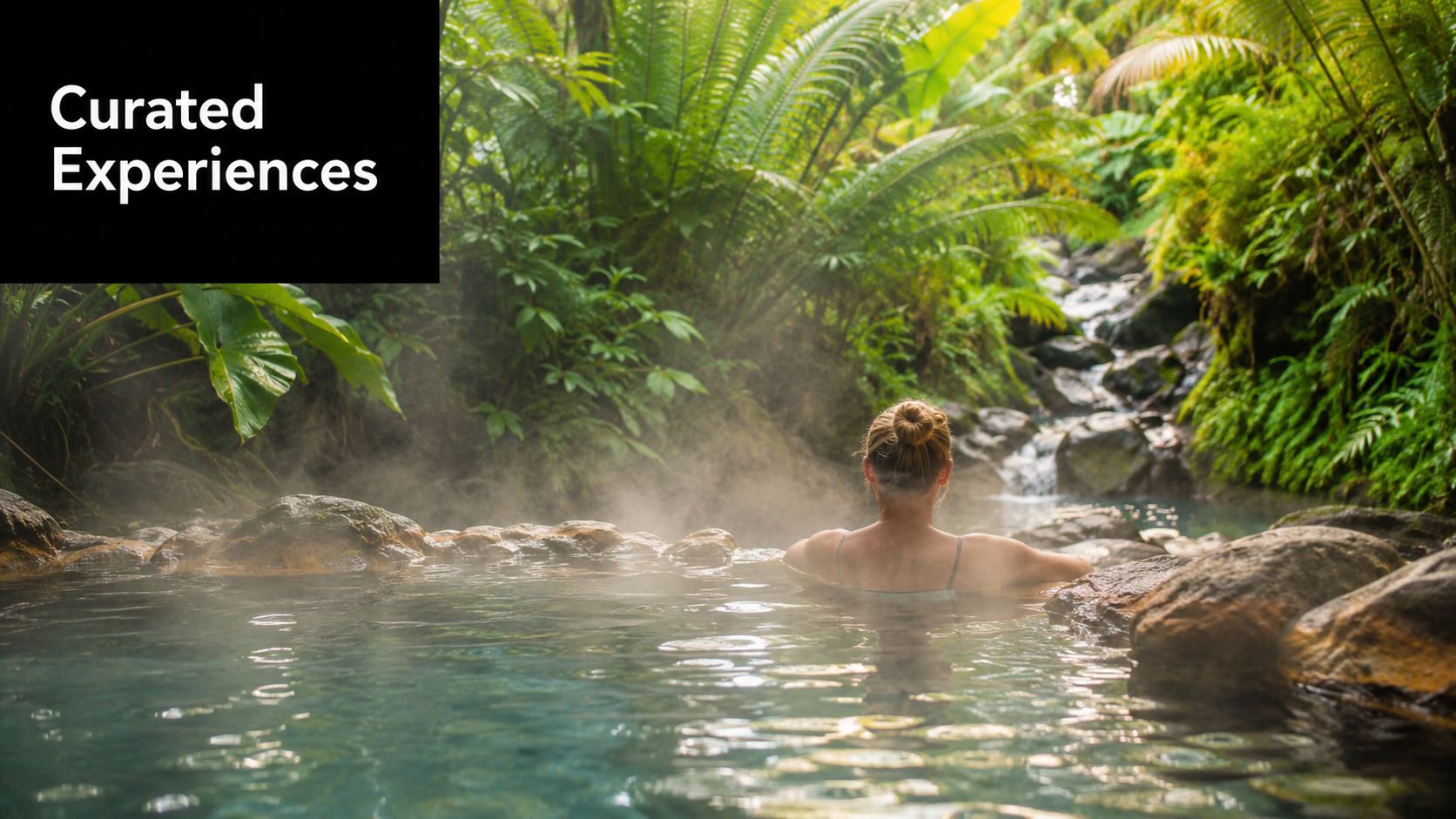 A person relaxing in a natural hot spring surrounded by lush tropical vegetation in Costa Rica.