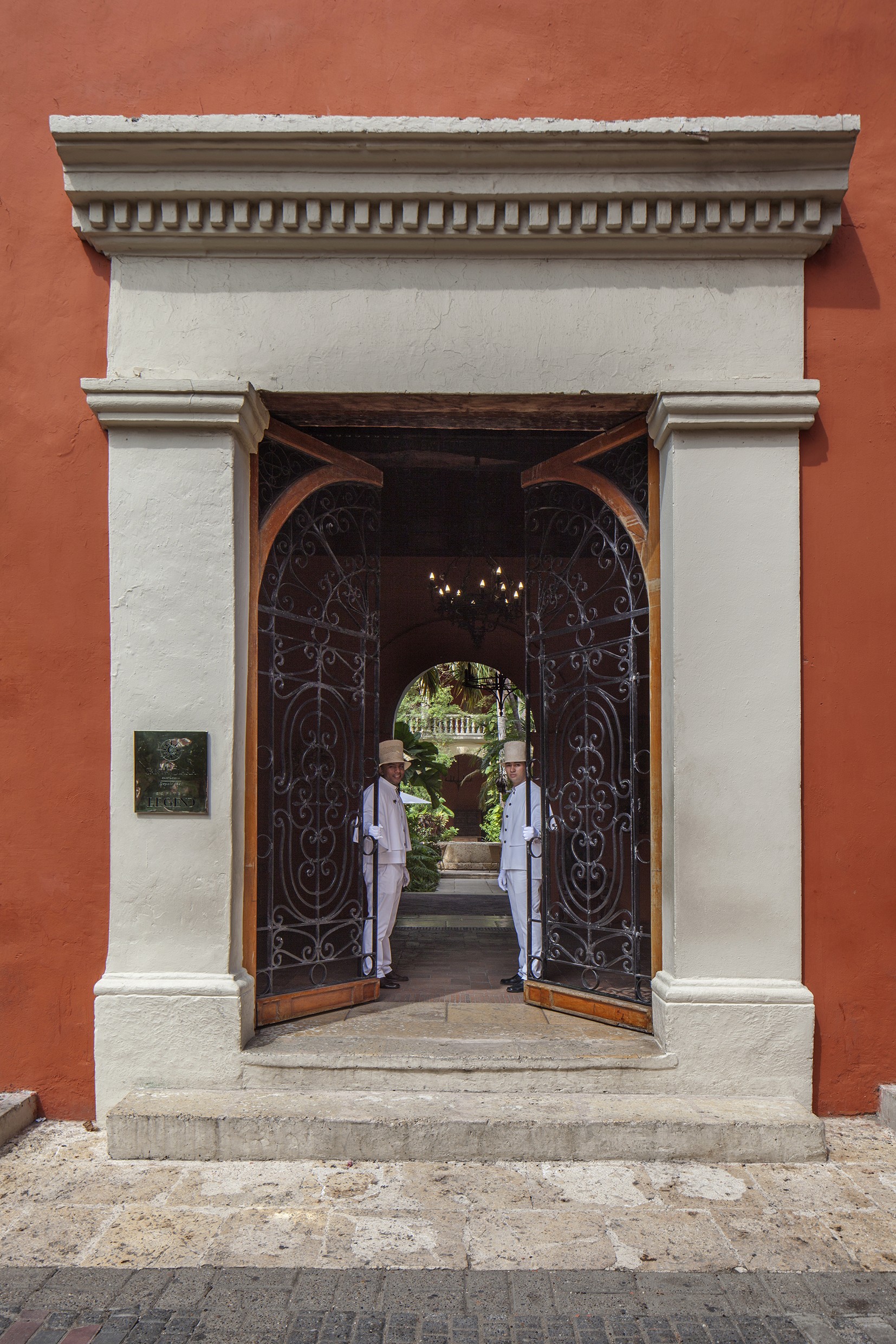 Creative portrait with geometric pink eyewear and bold fashion styling in urban setting