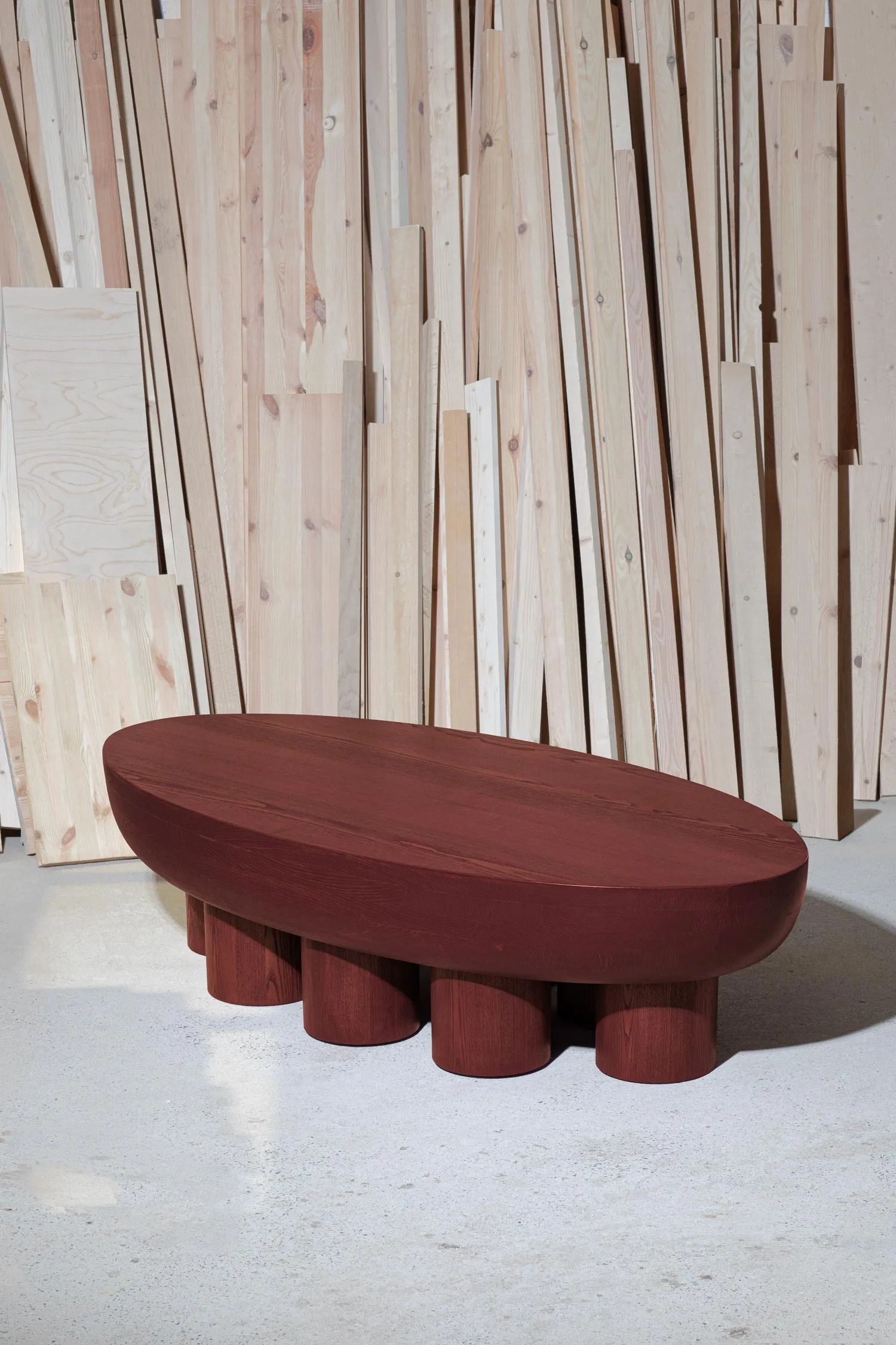 cyclades oval low table rusty red colored finish by Jiri Krejcirik