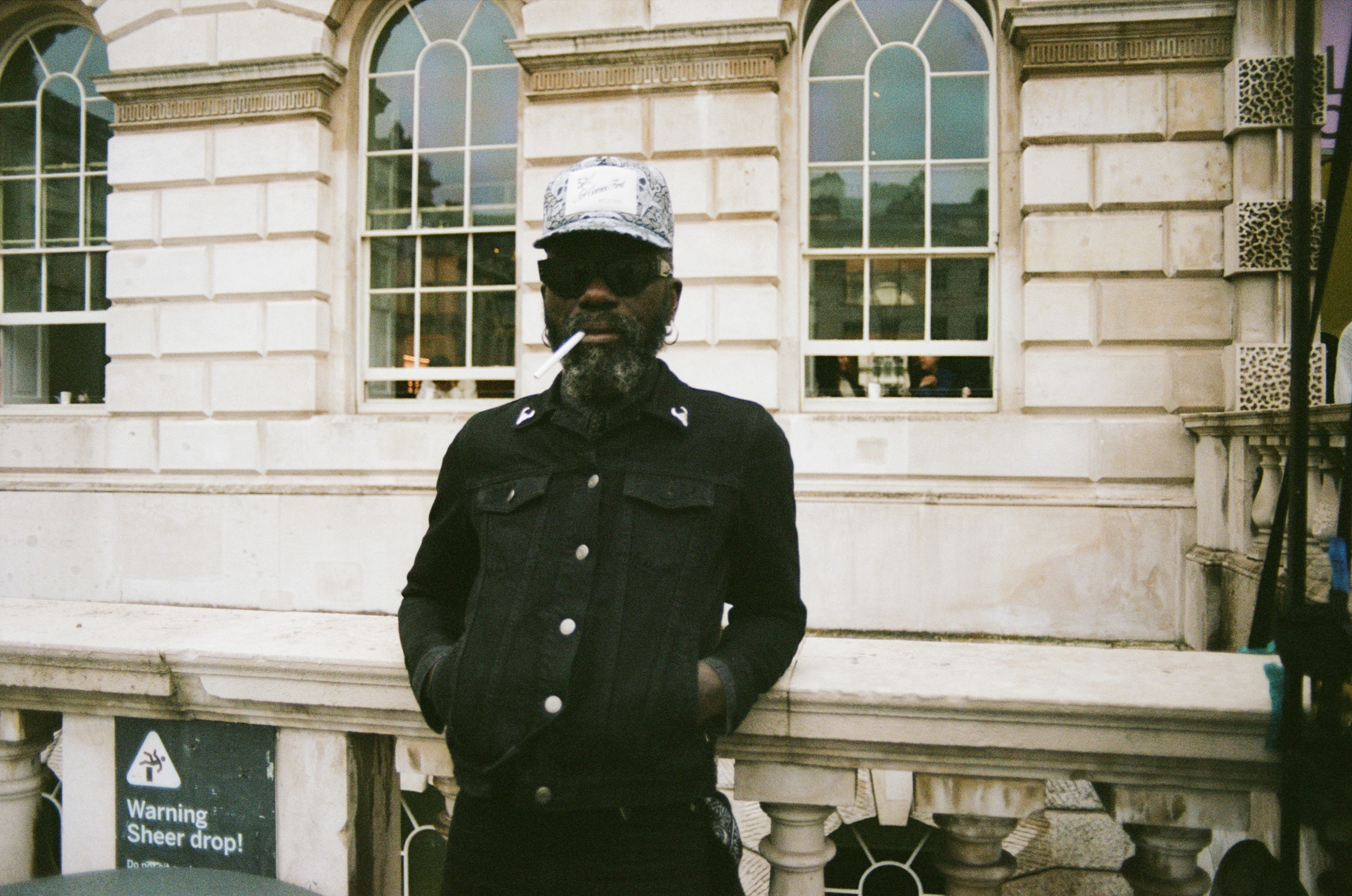 Modern skyscrapers line a busy highway in a sprawling city.