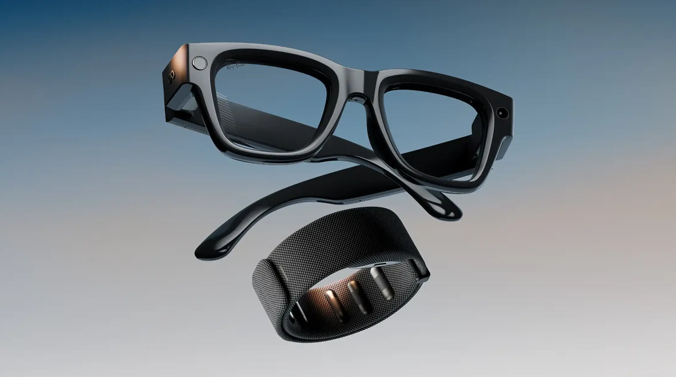 Meta Ray-Ban Display smart glasses with dark tinted lenses and a visible front-facing camera, shown alongside a wrist-worn neural input band, floating against a blue-gray gradient background.
