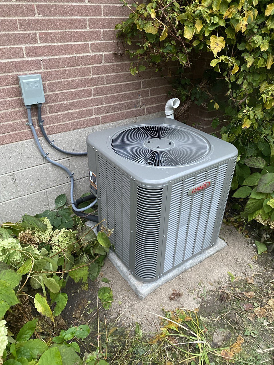AC unit in a Burlington backyard during air conditioner repair service