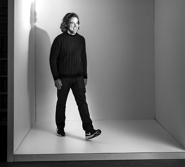 Rooftops of a coastal town with the sea in background