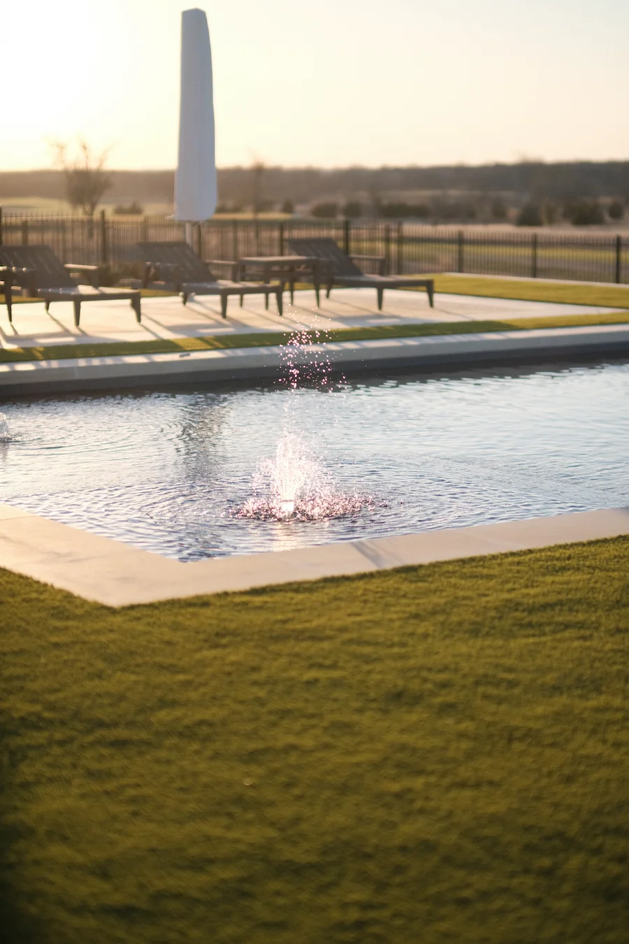Custom pool fountain water feature design for luxury Dallas Fort Worth property by Blount Designs