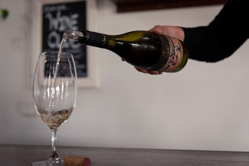 World class white wine being poured into a glass