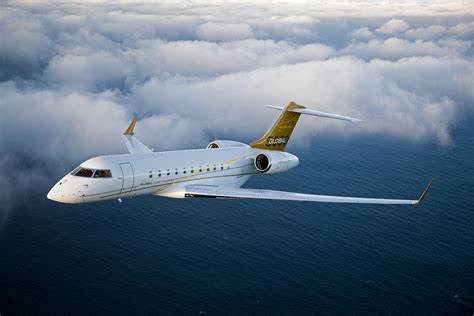 The Global 5000 is a long-range business jet produced by Canadian manufacturer Bombardier Aerospace. Here are some of its specifications:     Range: 5,200 nautical miles (9,630 km)  Maximum cruise speed: Mach 0.89 (590 mph or 950 km/h)  Maximum altitude: 51,000 feet (15,545 meters)  Seating capacity: Up to 17 passengers  Cabin dimensions: 6 feet 2 inches (1.88 meters) in height, 8 feet 2 inches (2.49 meters) in width, and 42 feet 6 inches (12.95 meters) in length  Baggage capacity: 195 cubic feet (5.52 cubic meters)  Engines: 2x Rolls-Royce BR710 turbofans  Maximum takeoff weight: 92,750 pounds (42,050 kg)  Avionics: Rockwell Collins Pro Line Fusion with four 14-inch high-resolution displays and head-up display (HUD)   