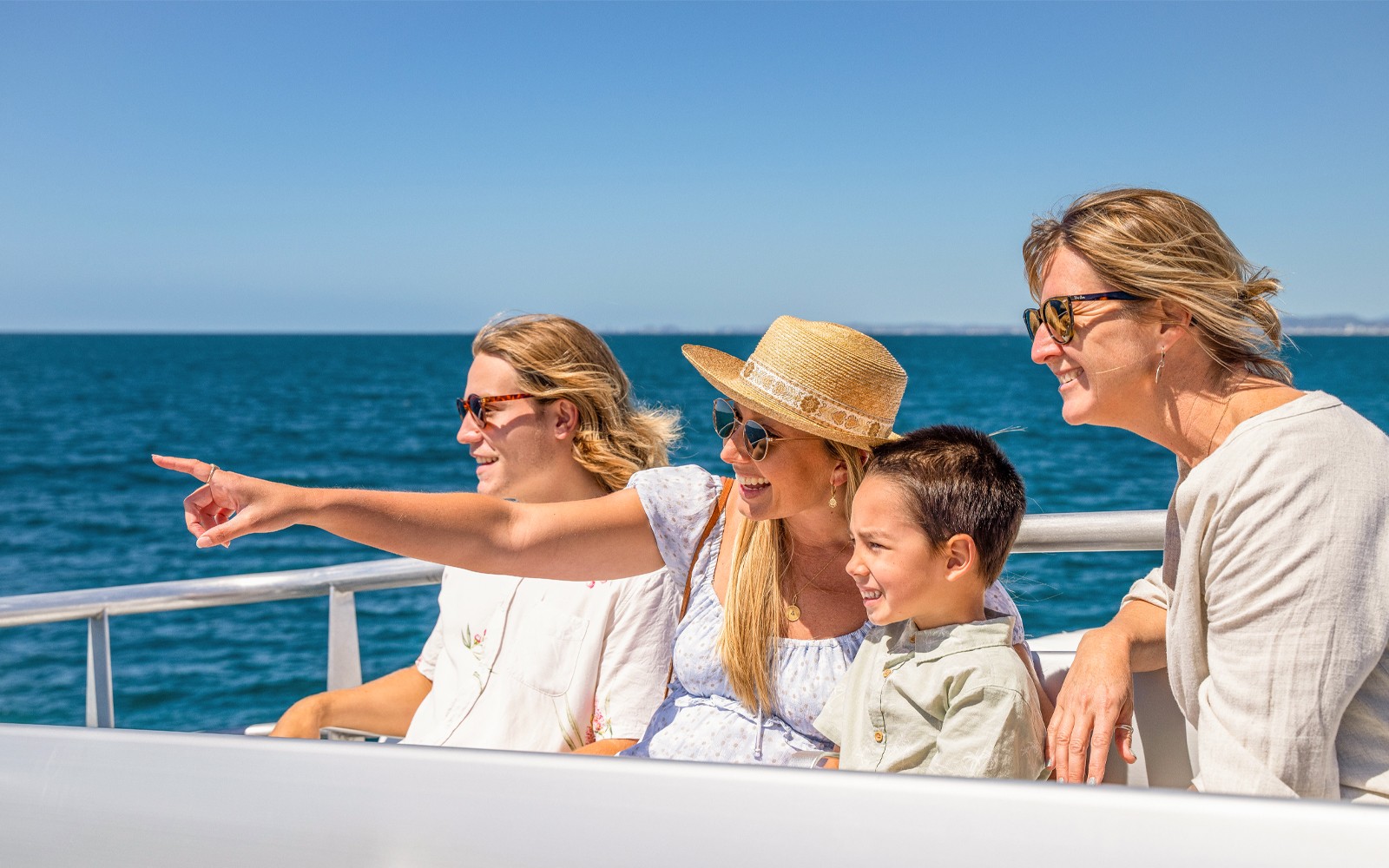 Family enjoying a cruise on the Guadalquivir River in Seville.