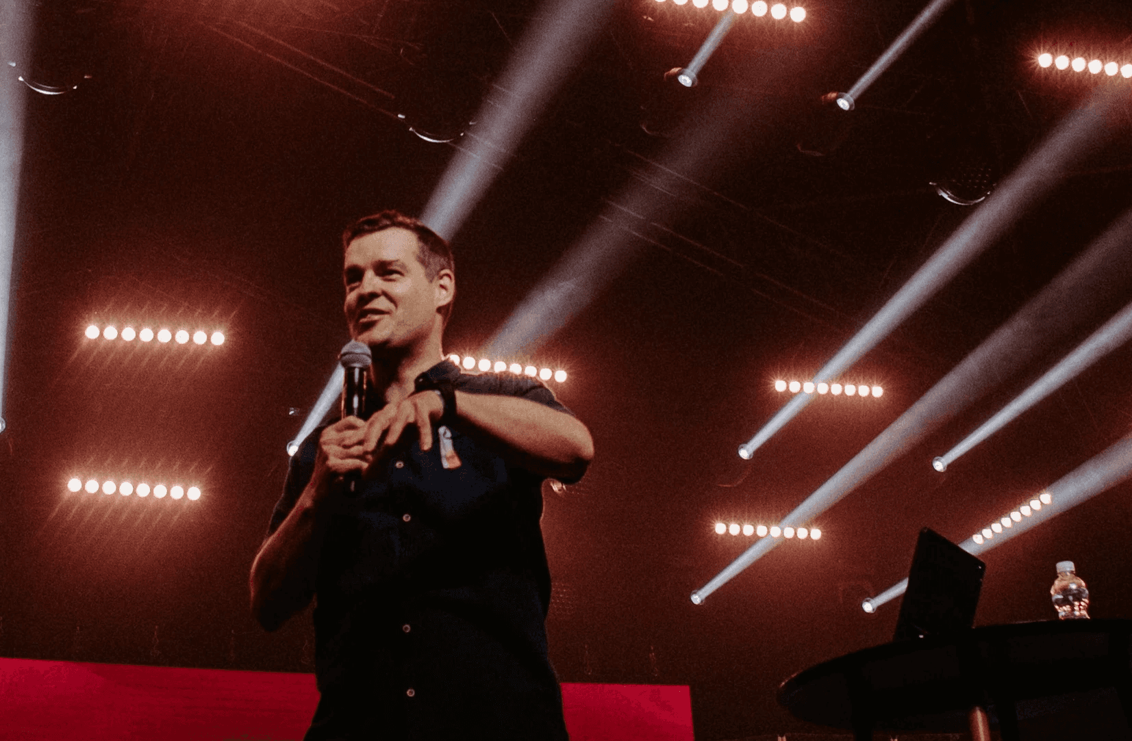 Smiling woman in feathered carnival costume