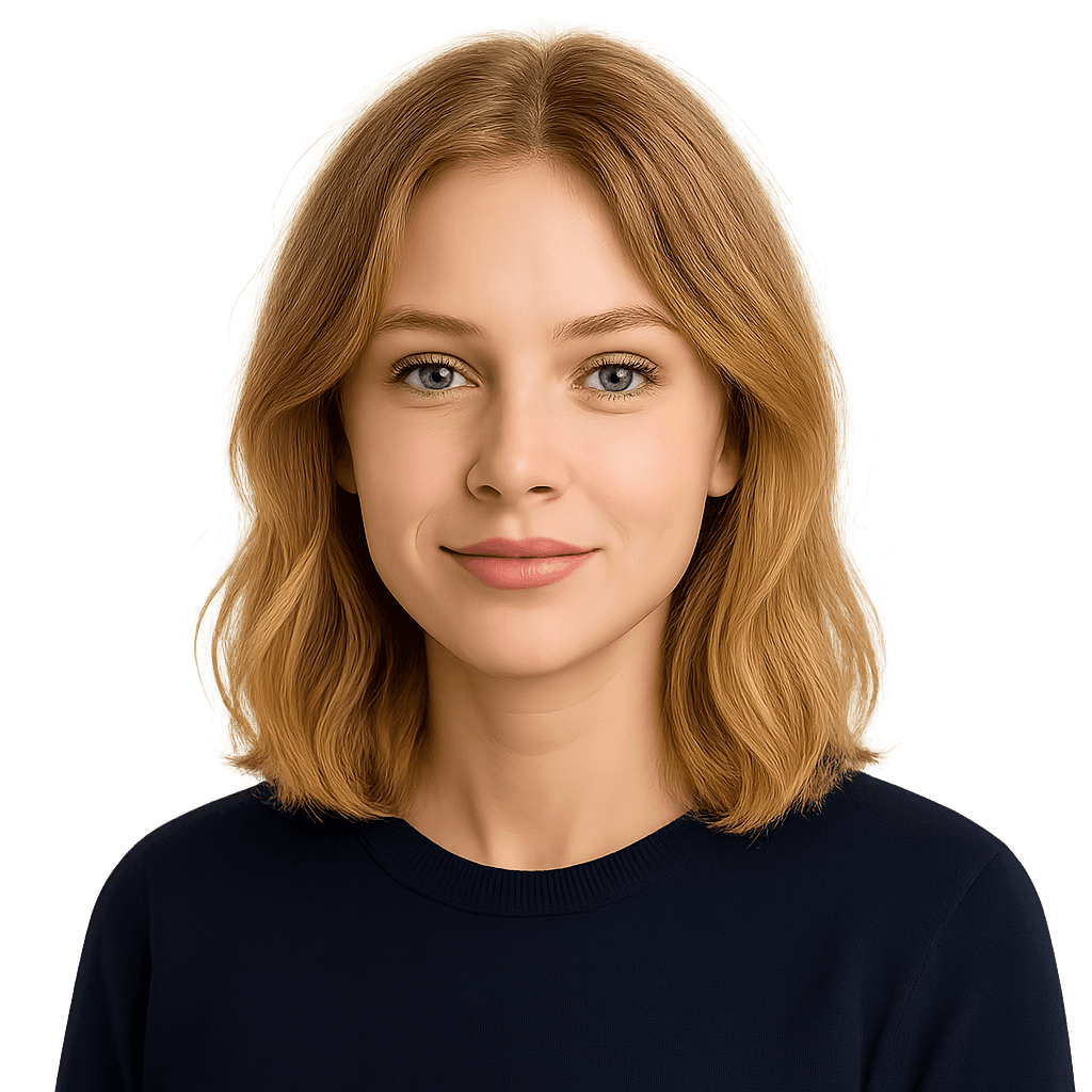 Blonde woman with wavy hair looking at the camera, wearing a navy blue top, smiling with blue eyes.