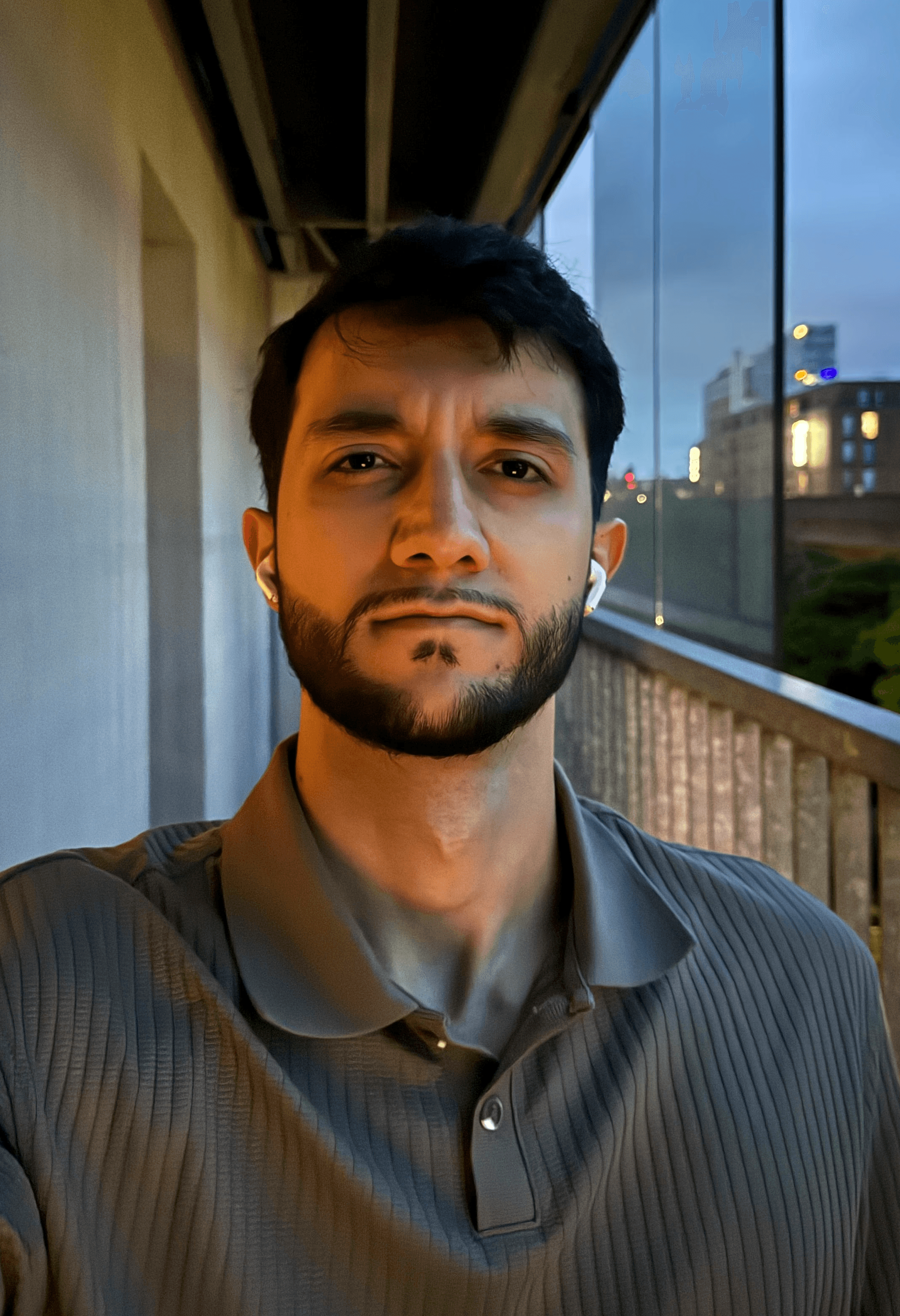 Portrait of a person in dark clothing speaking on a phone