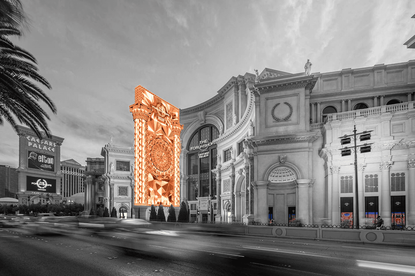 A photo of a large digital sign outside Caesars Palace. It's styles after roman columns