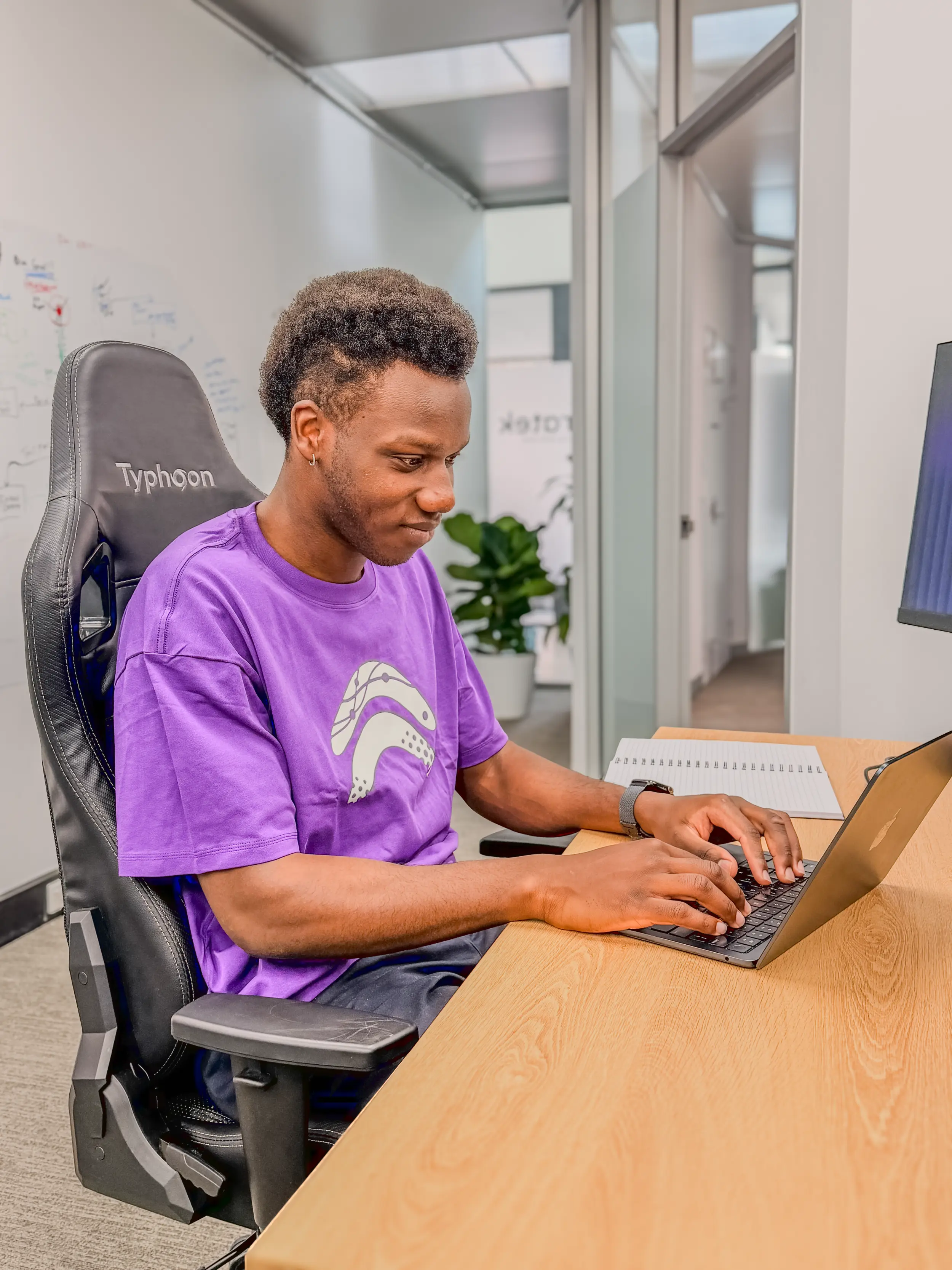A recruitment professional focused at her desk, representing  the document extraction and branding workflow in KET Studio.