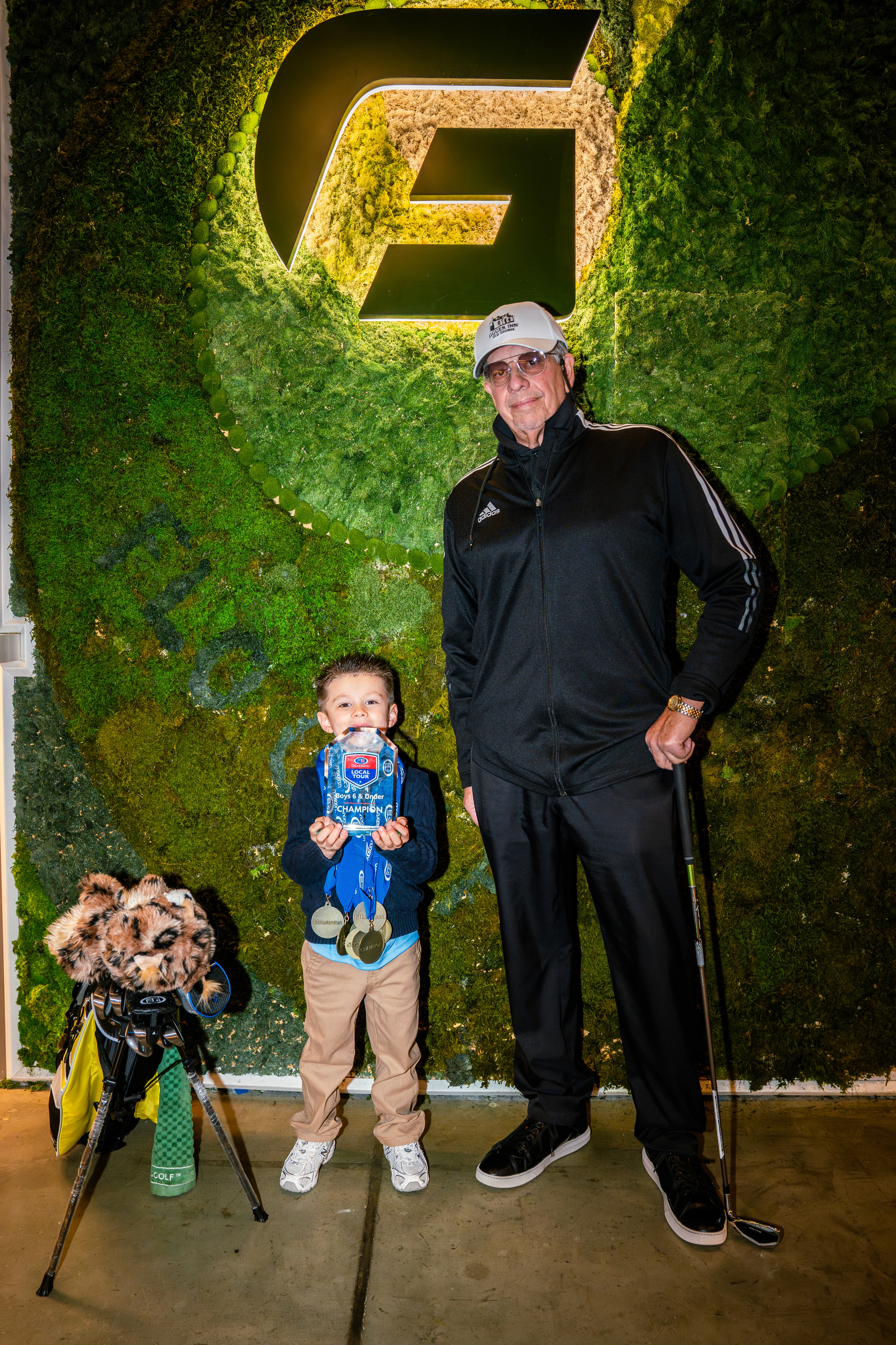 golf balls on the green grass with shoes
