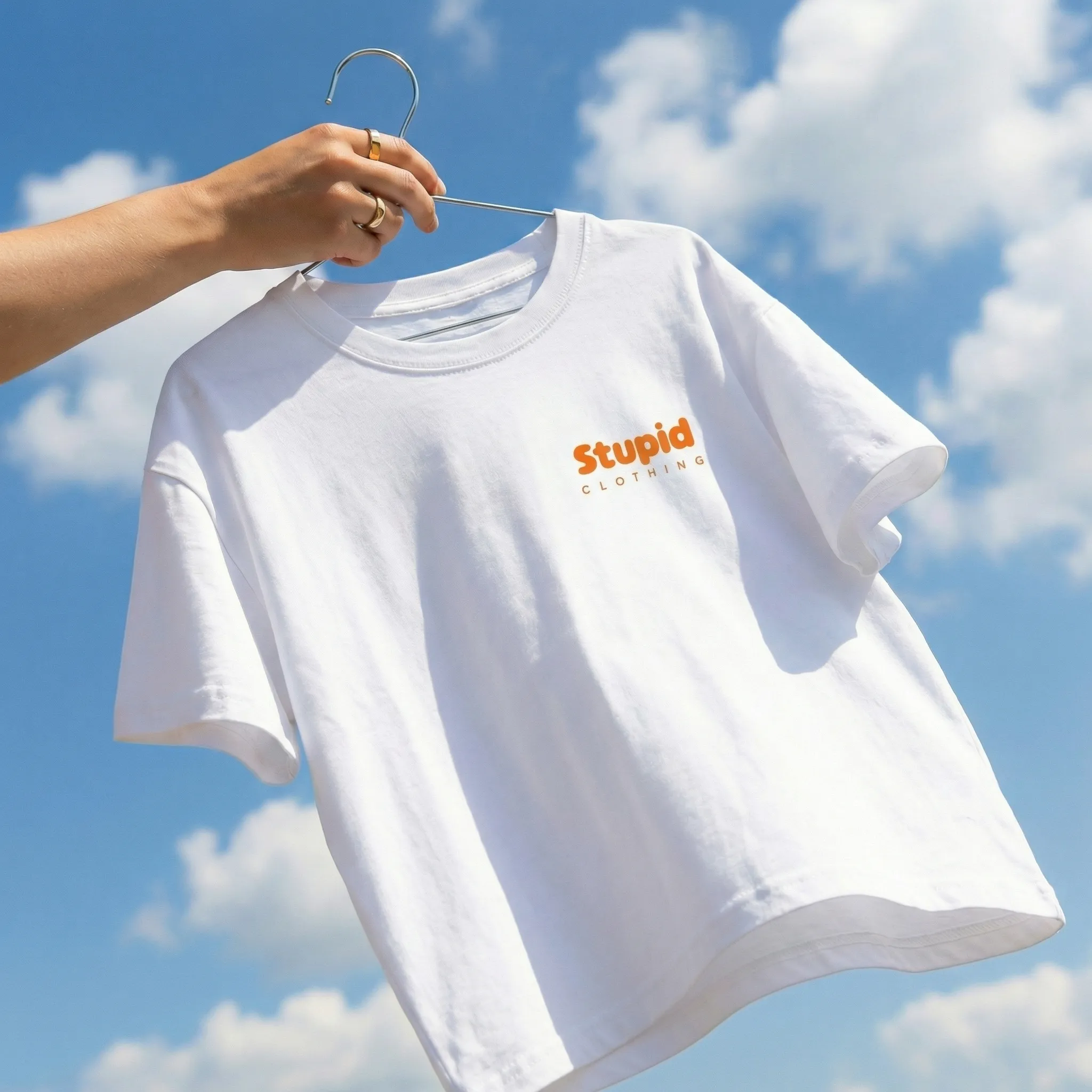 A group of people sitting at tables under umbrellas