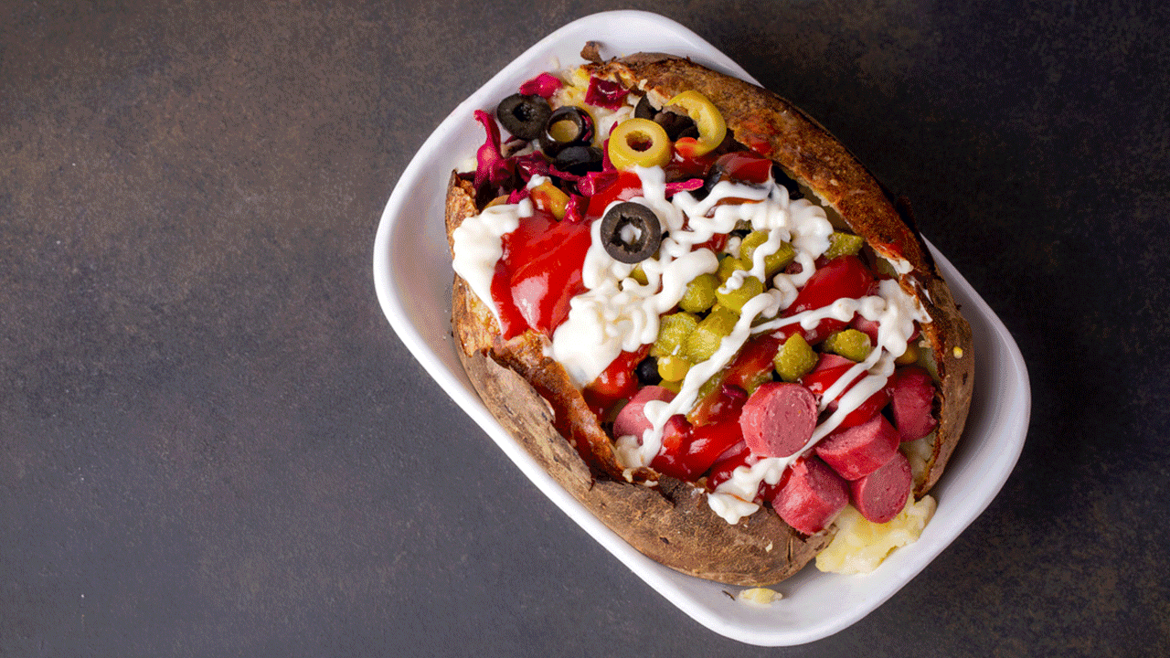 Famous Ortakoy kumpir stuffed baked potato street food in Istanbul