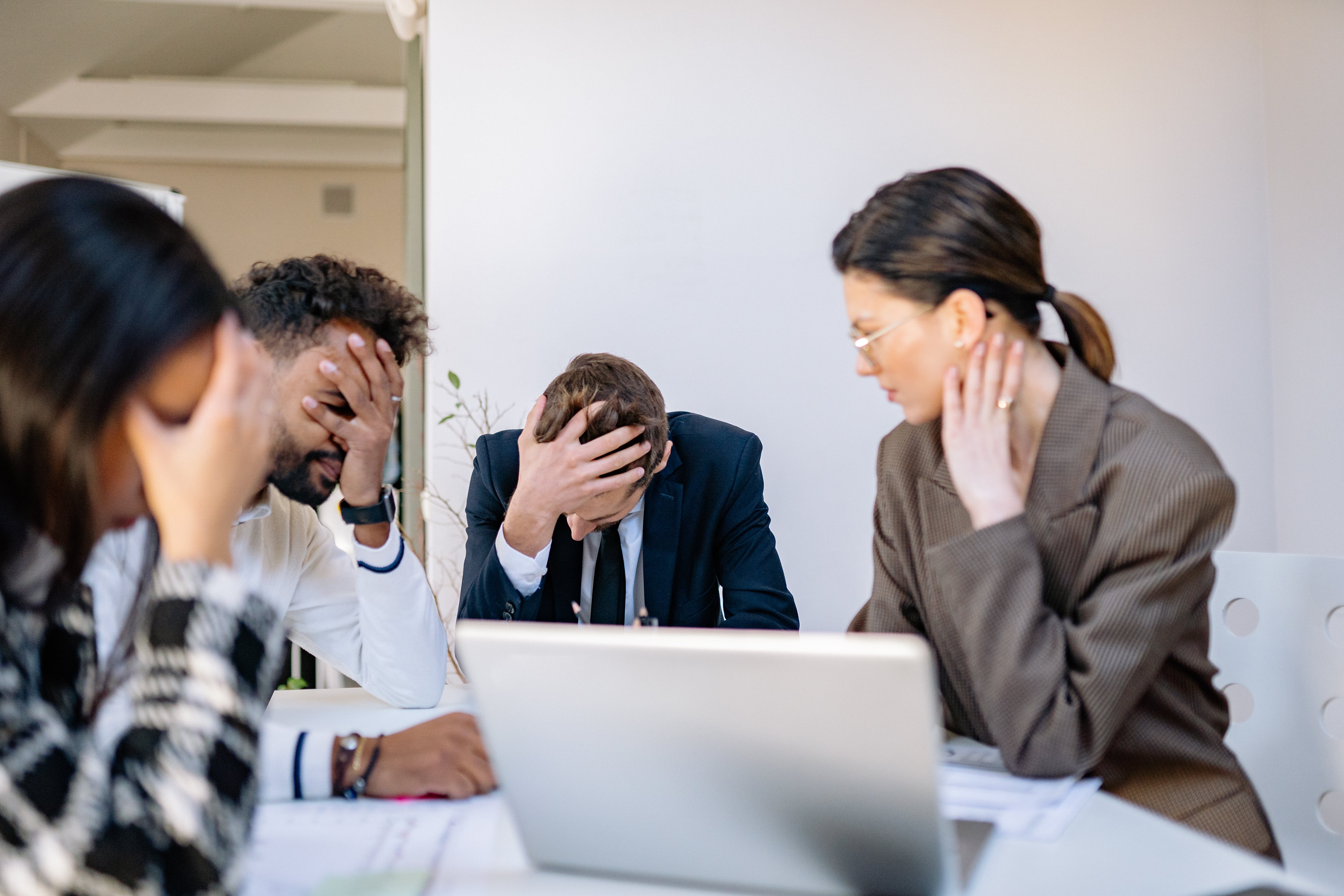 Stress business people at an office due to cold email spamming