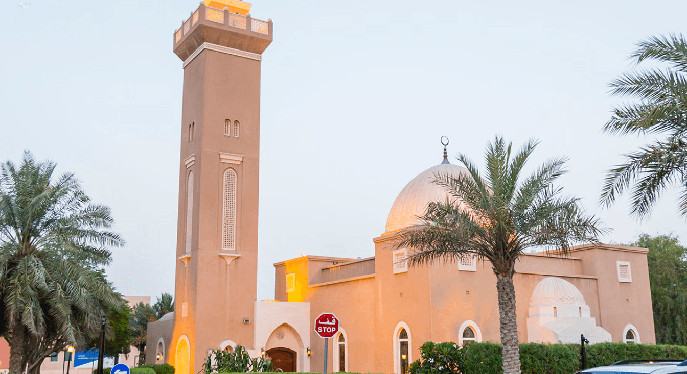 A notable large building with a clock tower, found in Arabian Ranches.