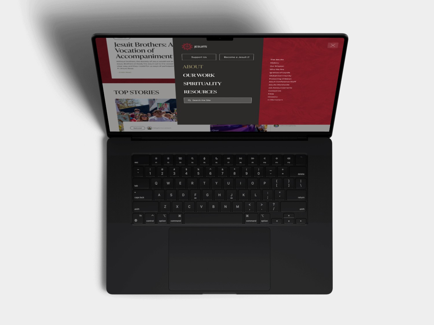 A top-down view of a laptop with a red and black design, displaying an open screen and keyboard.