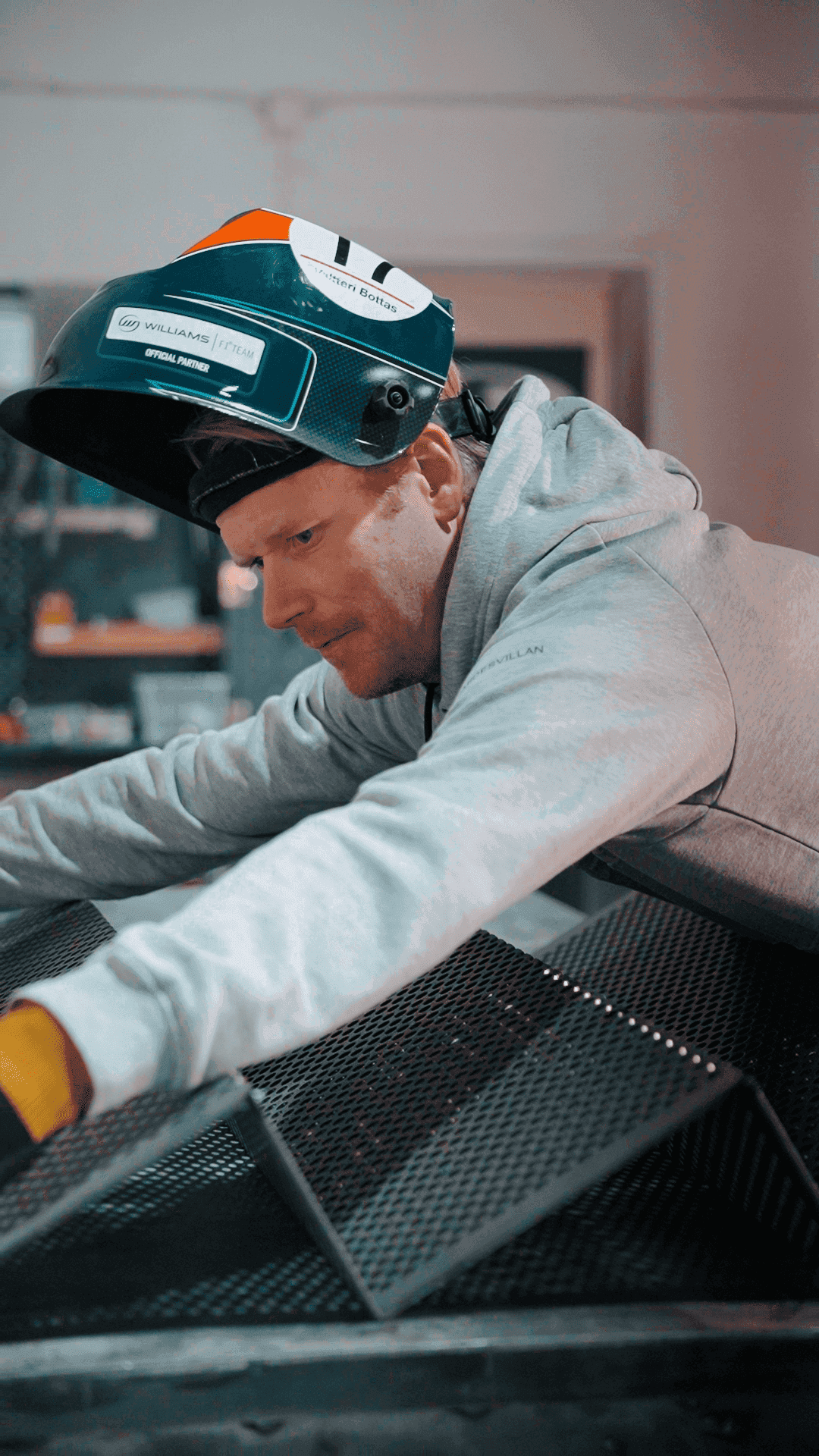welders working on a piece of metal in the dark