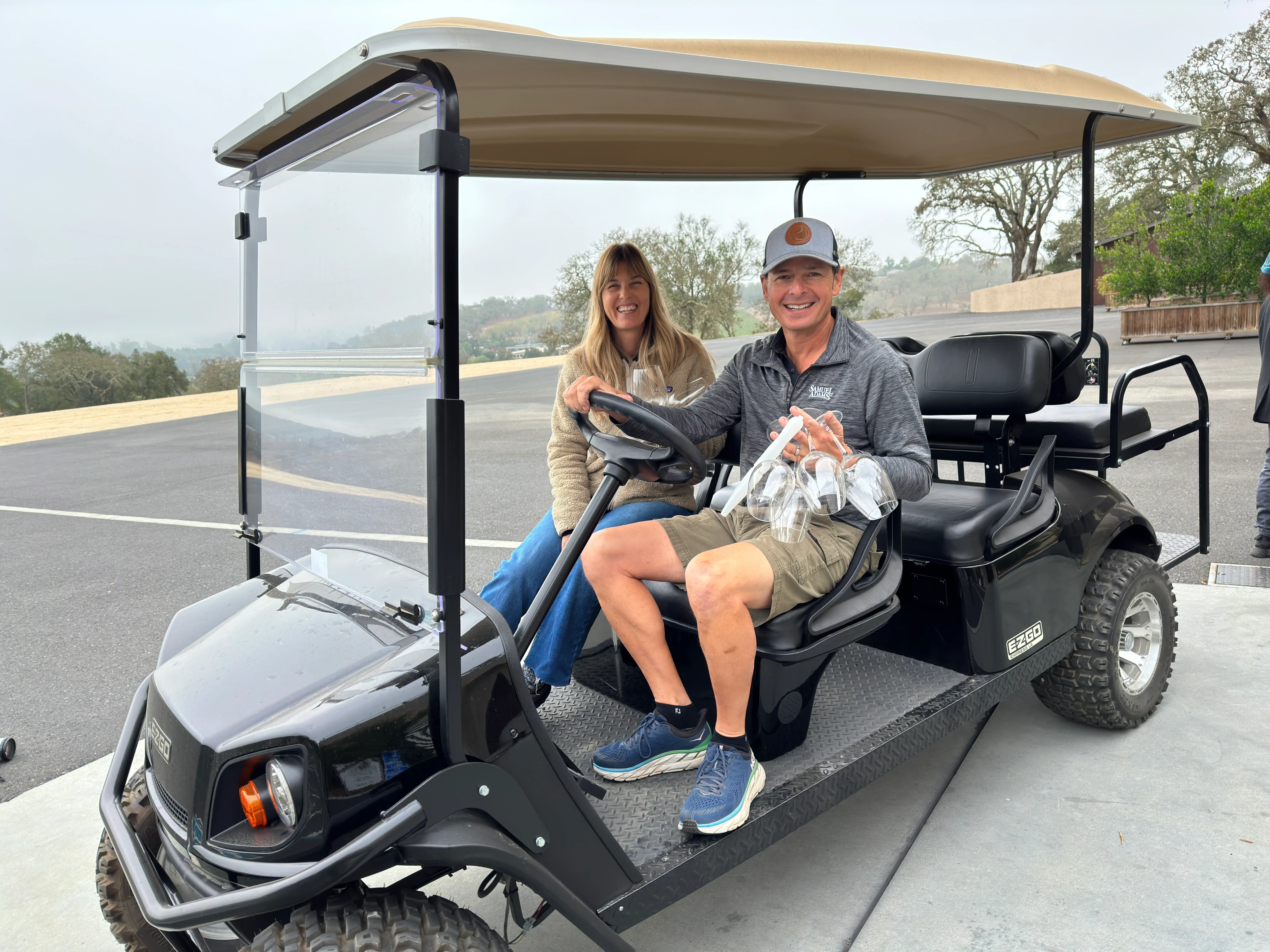 Rudy and Amy in a winery golf cart